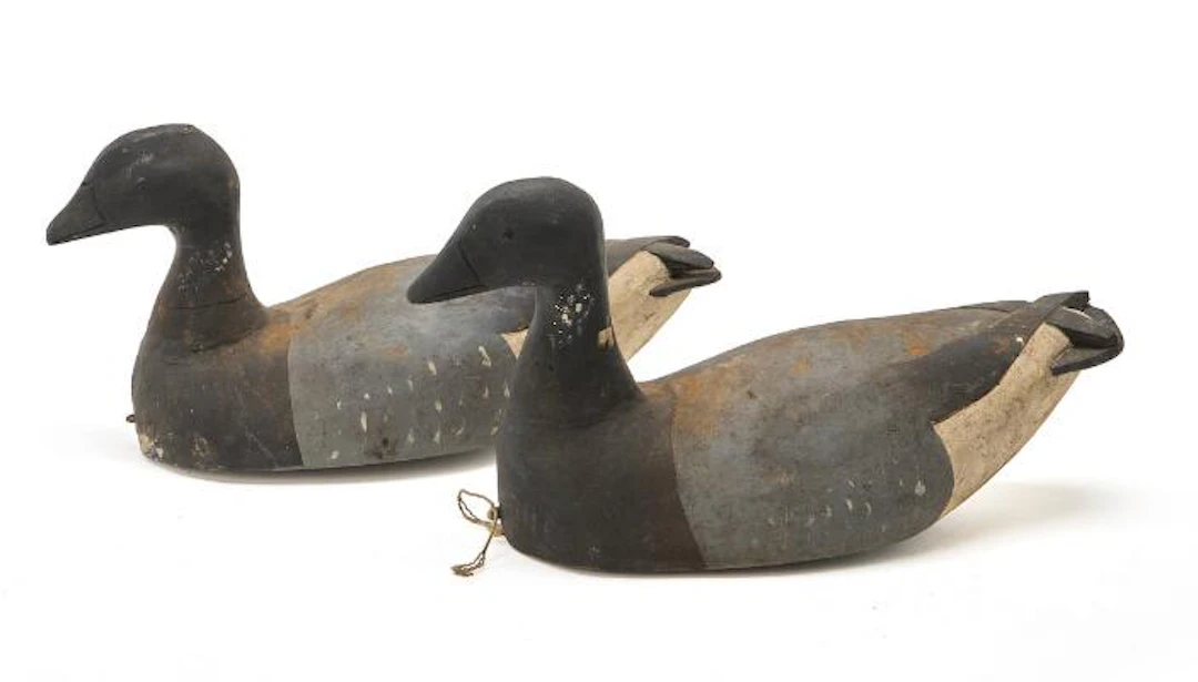 Unknown artist: A pair of carved and painted wooden decoy ducks. Signed