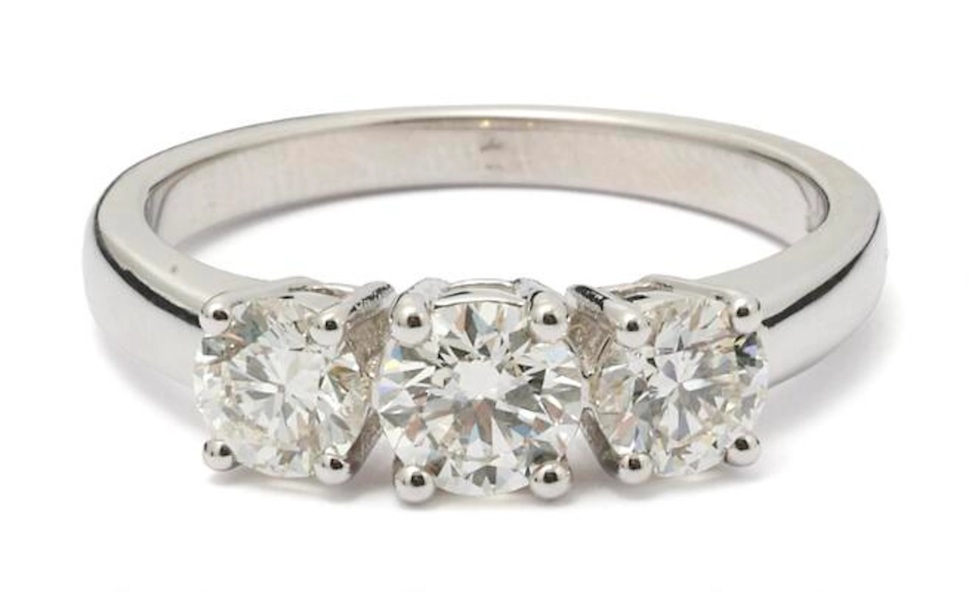 A diamond ring set with three diamonds mounted in 18k white gold.
