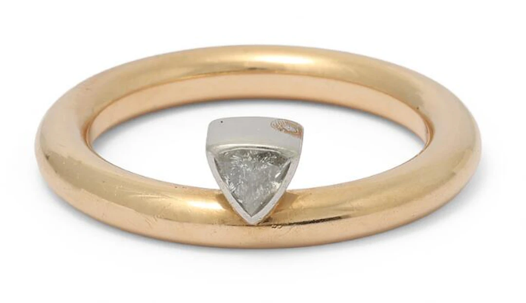 A diamond ring set with a trilliant-cut diamond, mounted in 14k gold
