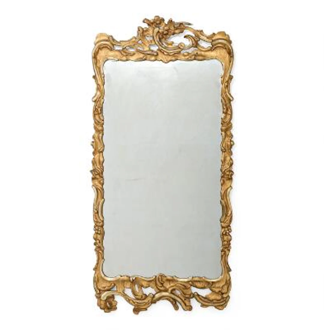 A Danish Rococo giltwood mirror with oprwork carvings. Late mirror.