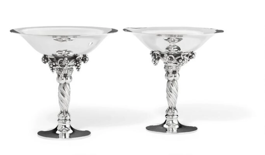 Georg Jensen: Two small sterling silver grape tazzas with hammered