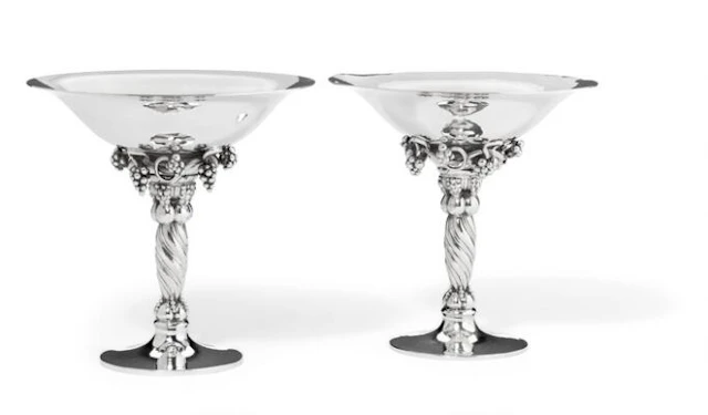 Georg Jensen: Two small sterling silver grape tazzas with hammered