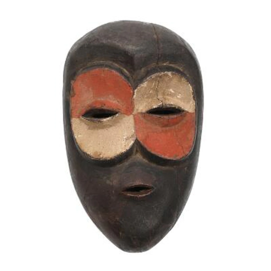 West African mask of carved wood with colour pigment. Cross River