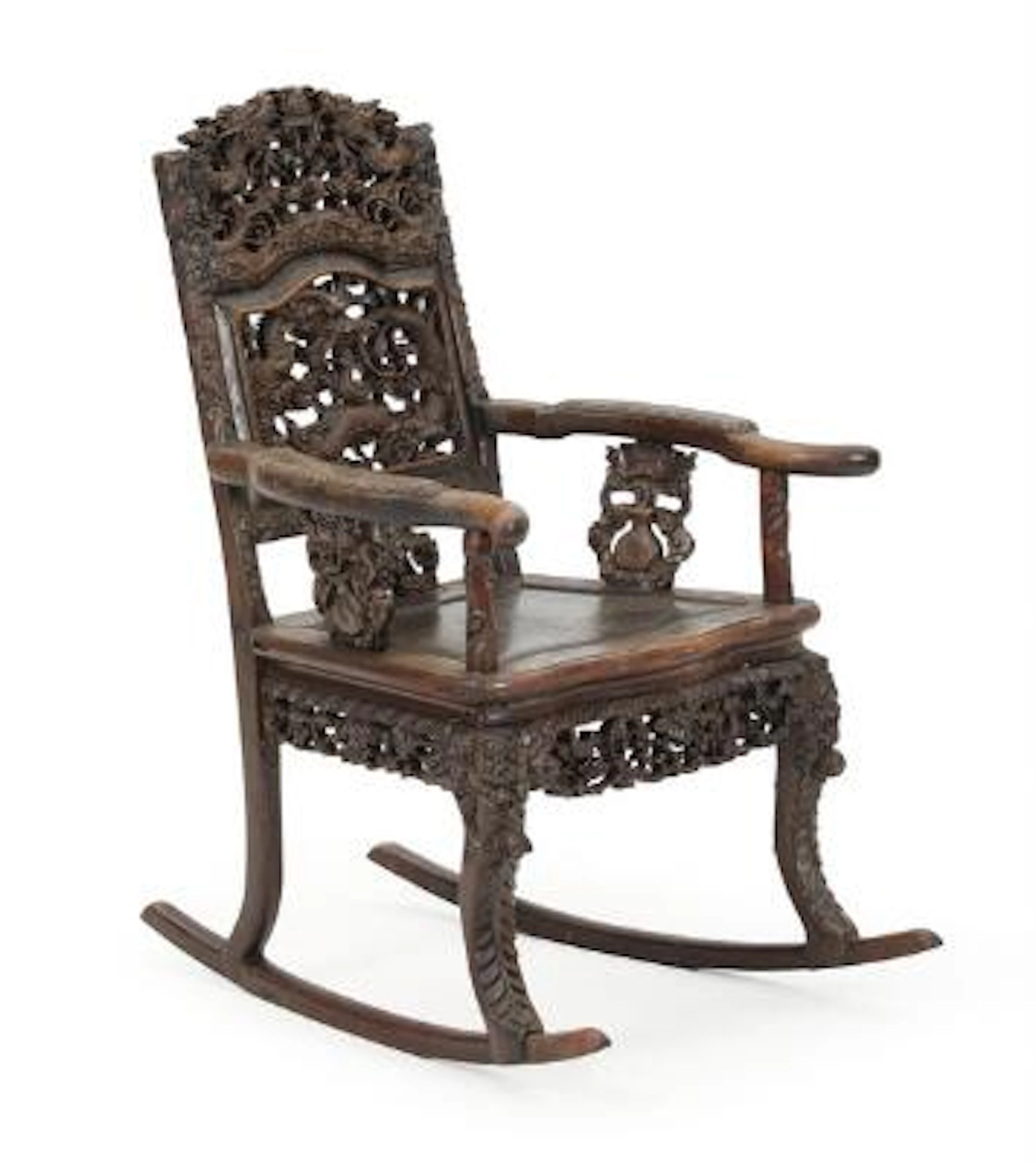 Chinese hardwood rocking chair, richly carved with dragons chasing