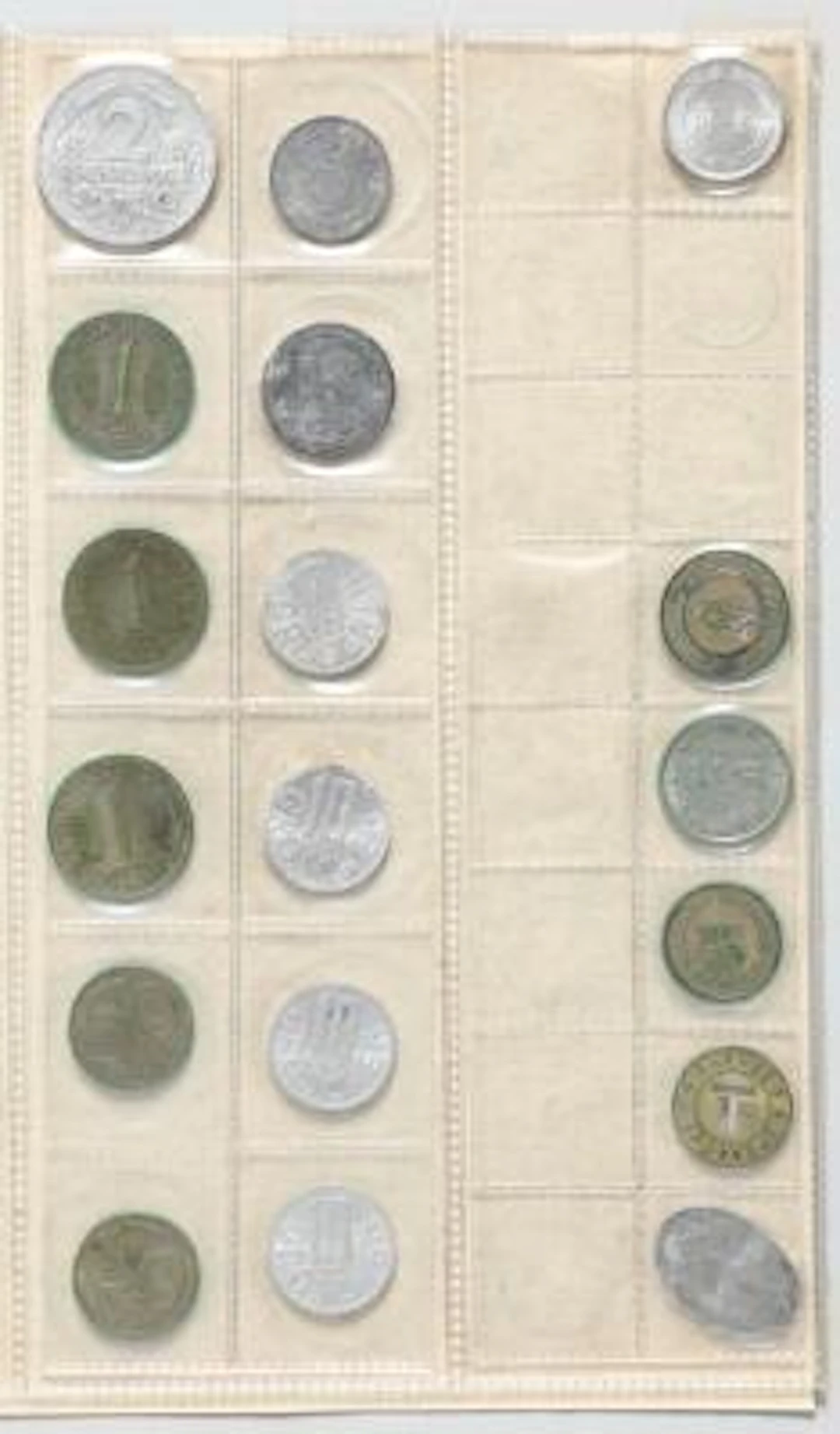 Album with collection of various foreign coins as well as a few tokens