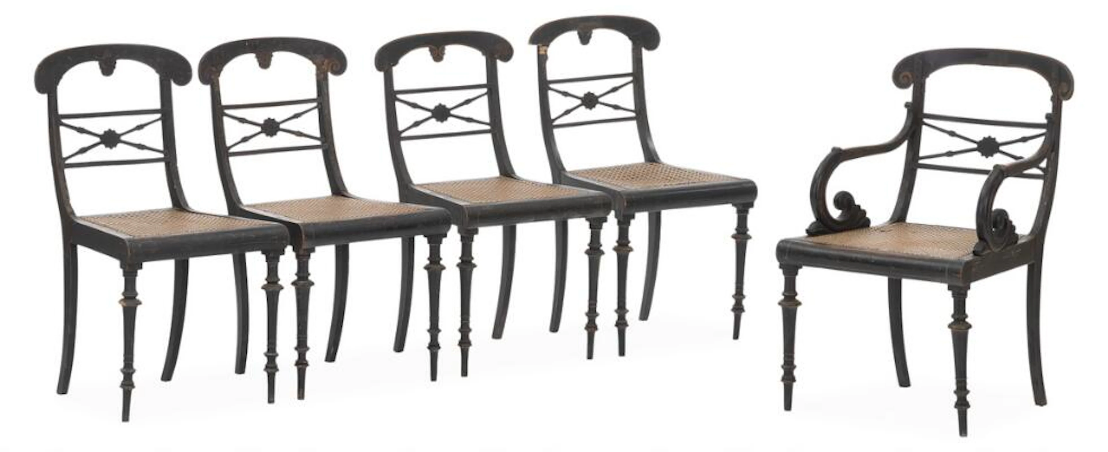 A set of six chairs of black painted wood, including one armchair.