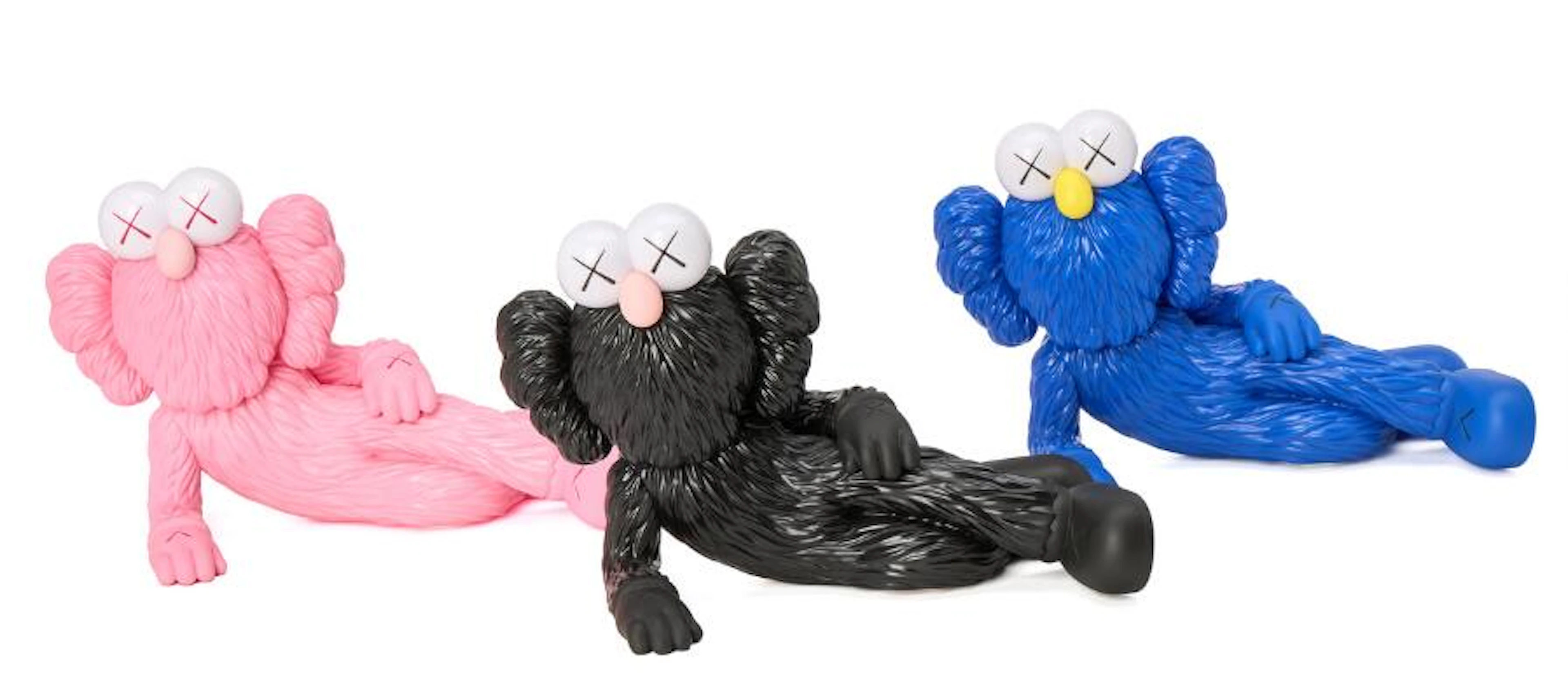 KAWS: "Time Off". Open Edition. Three figures of molded vinyl and