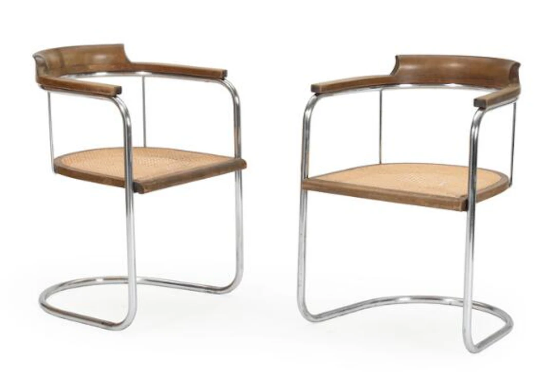 Fritz Hansen: A pair of cantilever armchairs with chromed steel tube