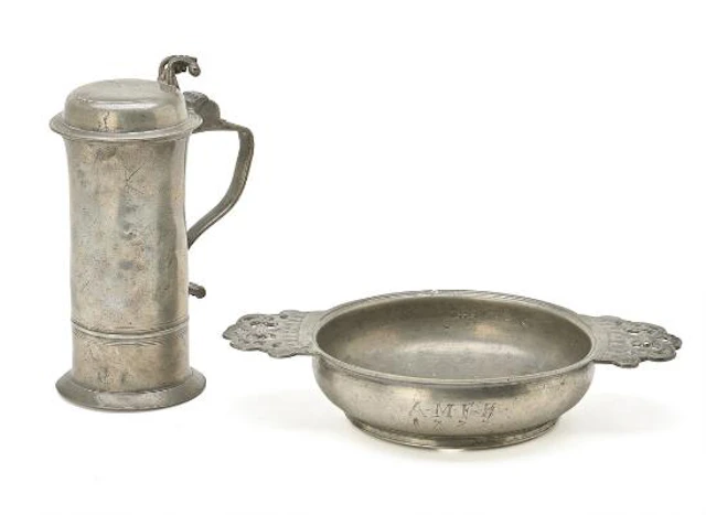 Two pewter items comprising of a presumably German ear cup and a tankard.
