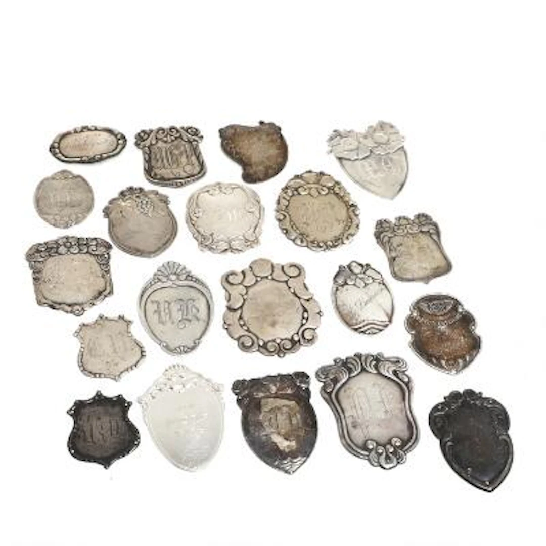 A collection of 20 silver coat badges. Denmark, 19th-20th century.
