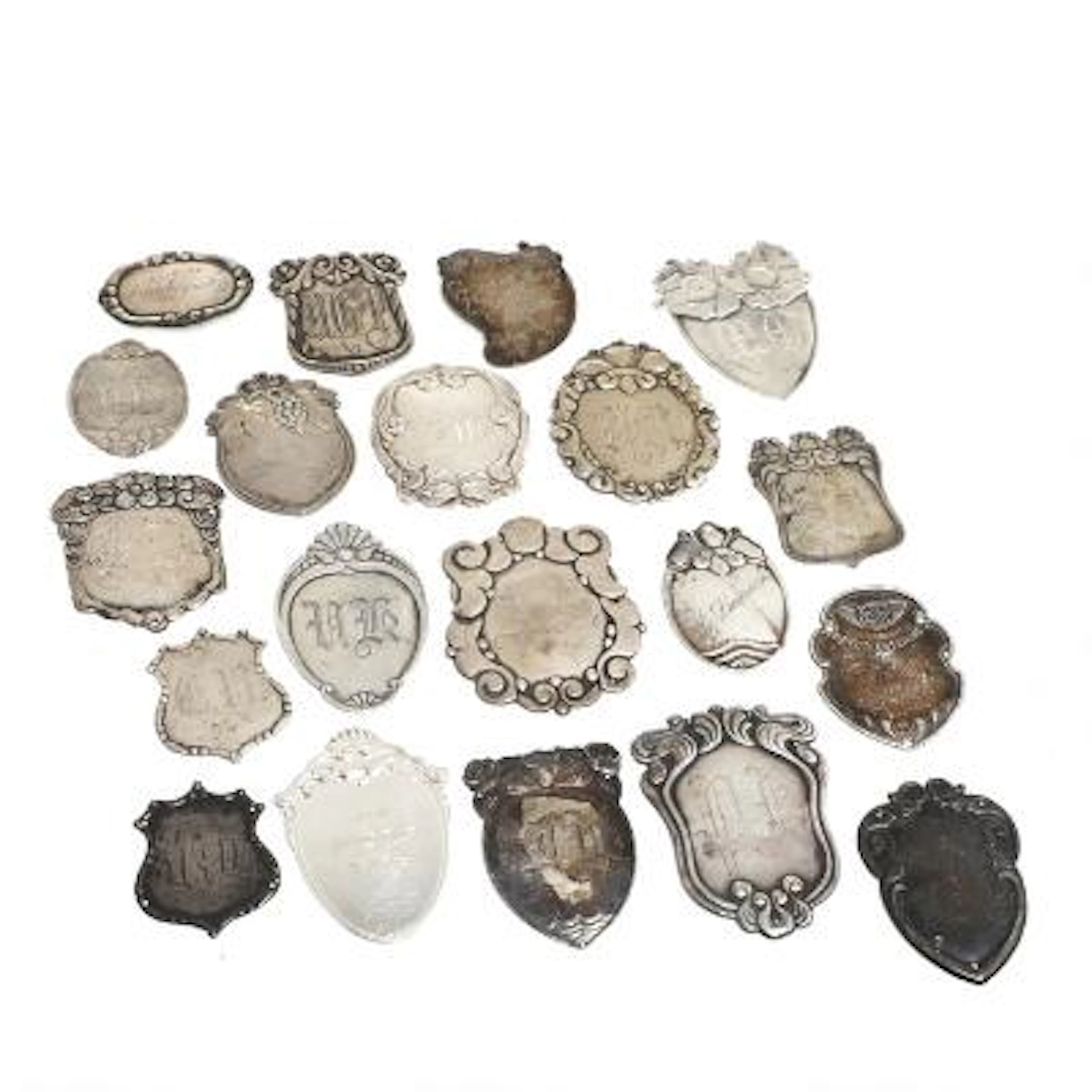 A collection of 20 silver coat badges. Denmark, 19th-20th century.