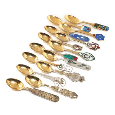A selection of 13 gilded sterling silver Christmas spoons and a commemorative
