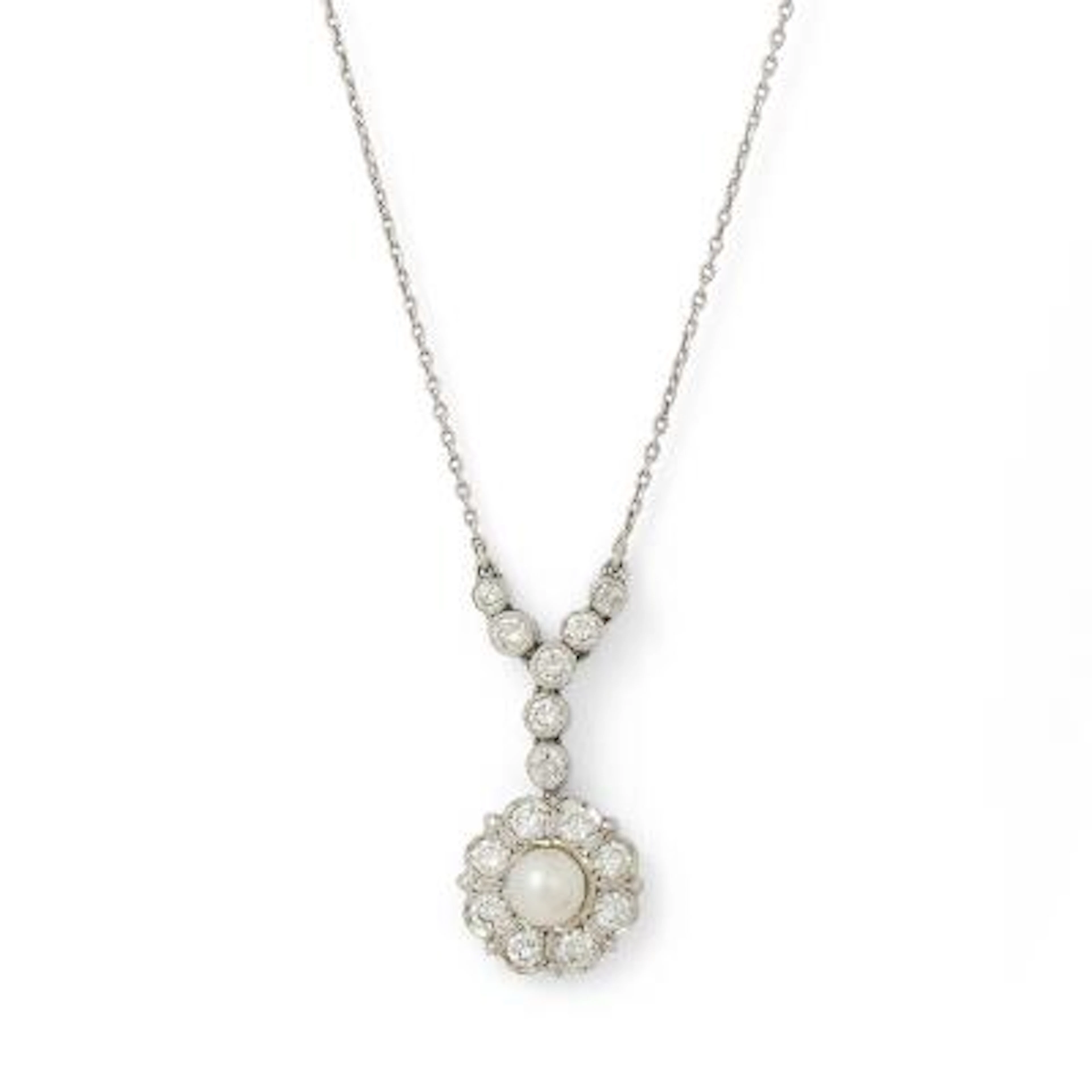 A pearl and diamond necklace set with numerous diamonds, mounted in