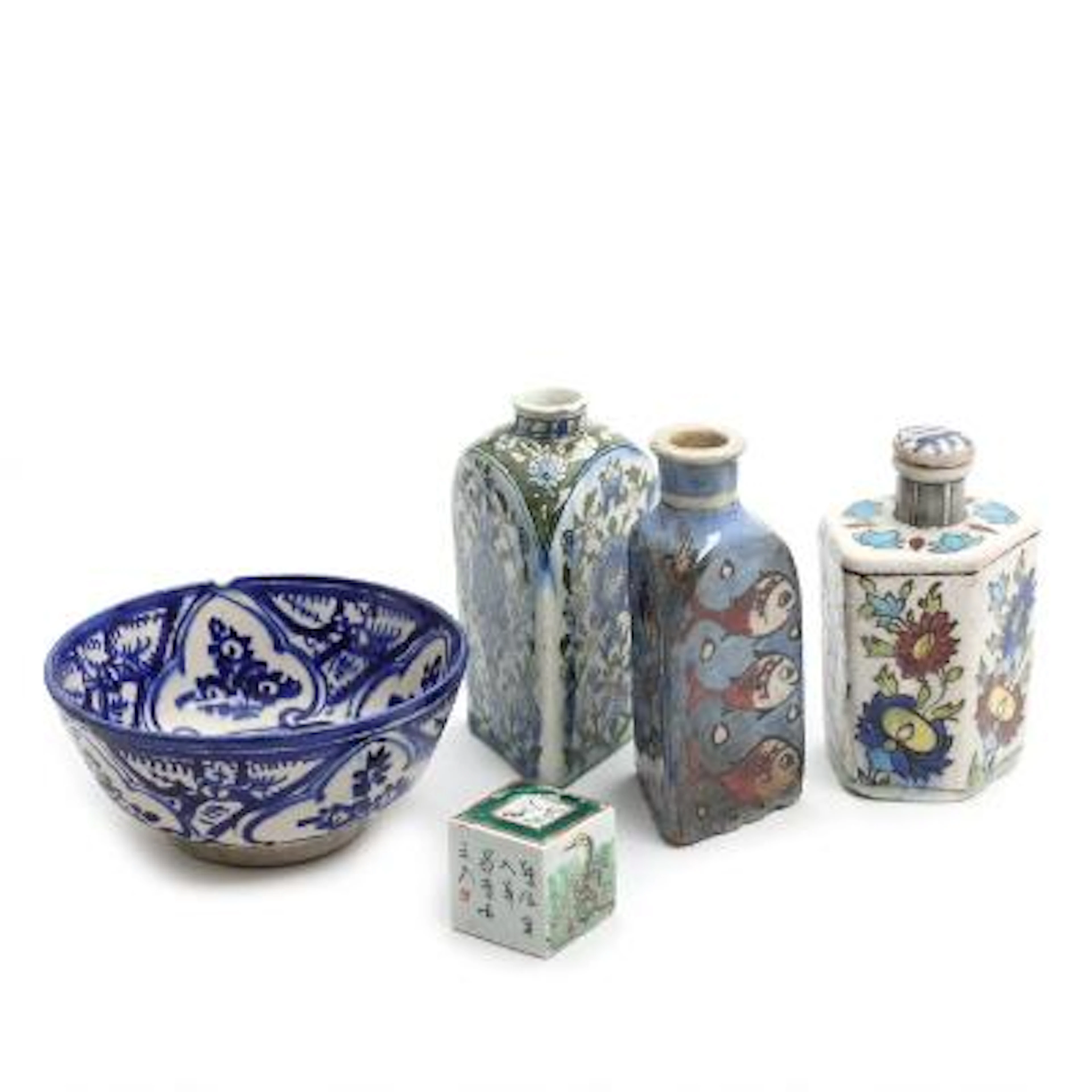 A selection of Persian pottery and a Chinese porcelain seal. 20th