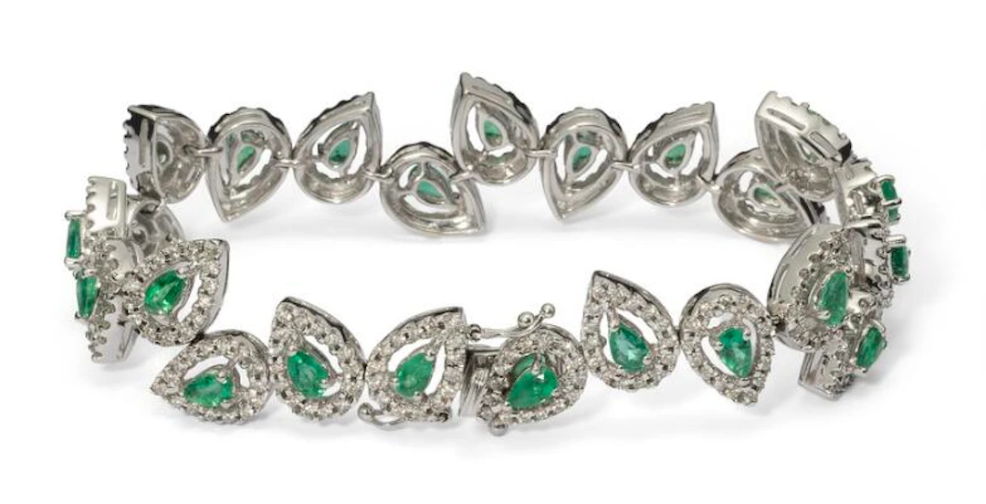 An emerald and diamond bracelet set with emeralds and diamonds, mounted