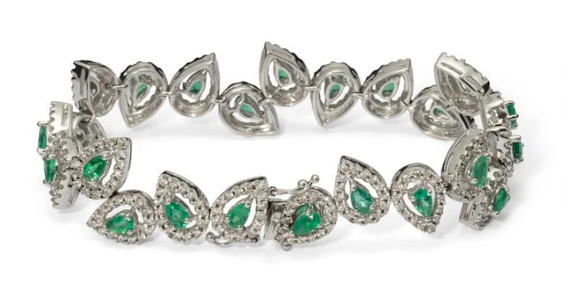 An emerald and diamond bracelet set with emeralds and diamonds, mounted