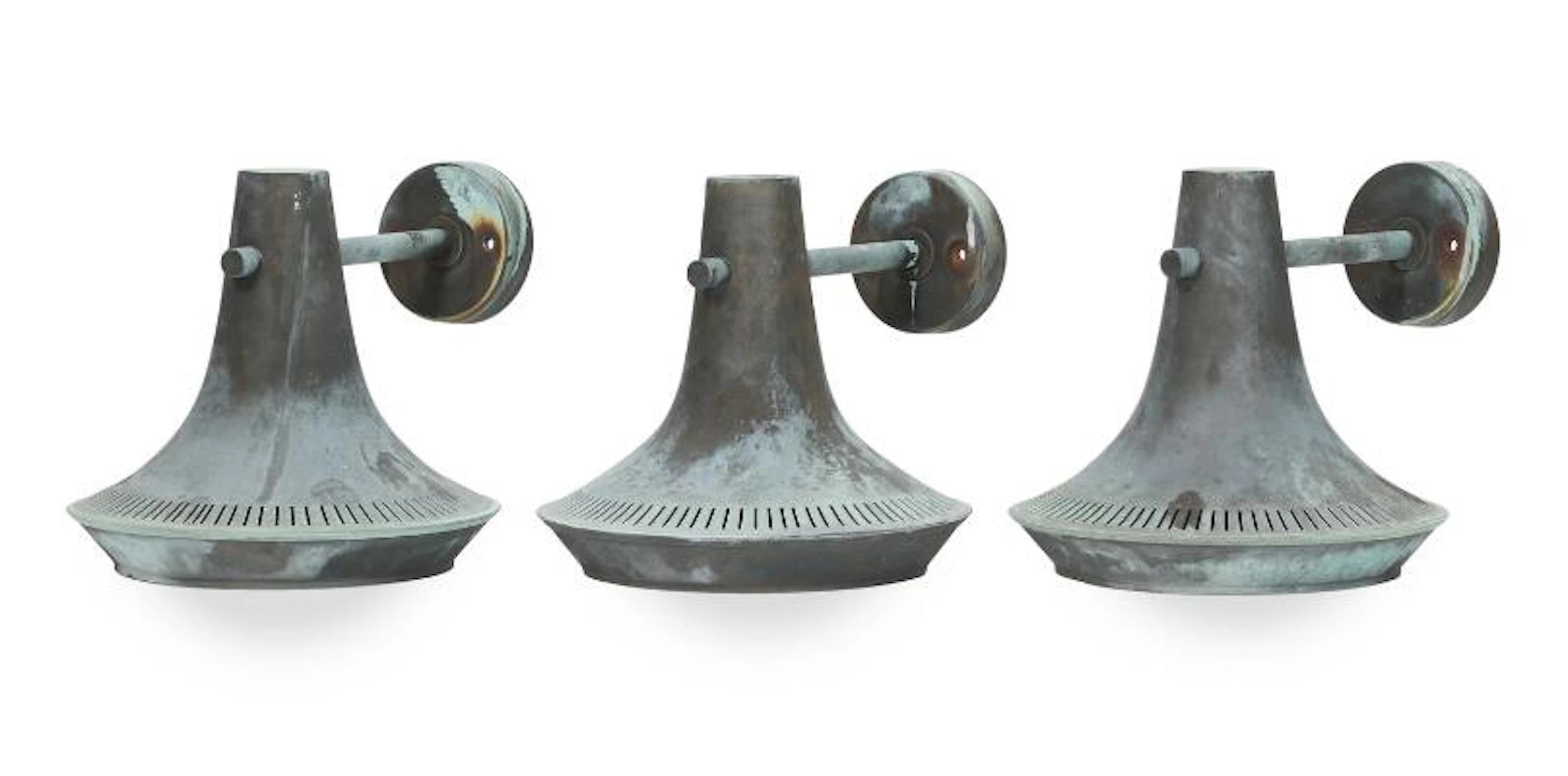 Hans Bergström, ascribed to: Three outdoor patinated copper wall lamps.