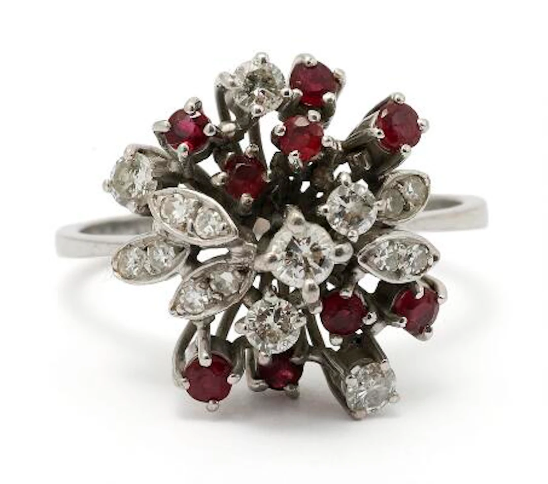 A ruby and diamond ring set with numerous rubies and diamonds mounted