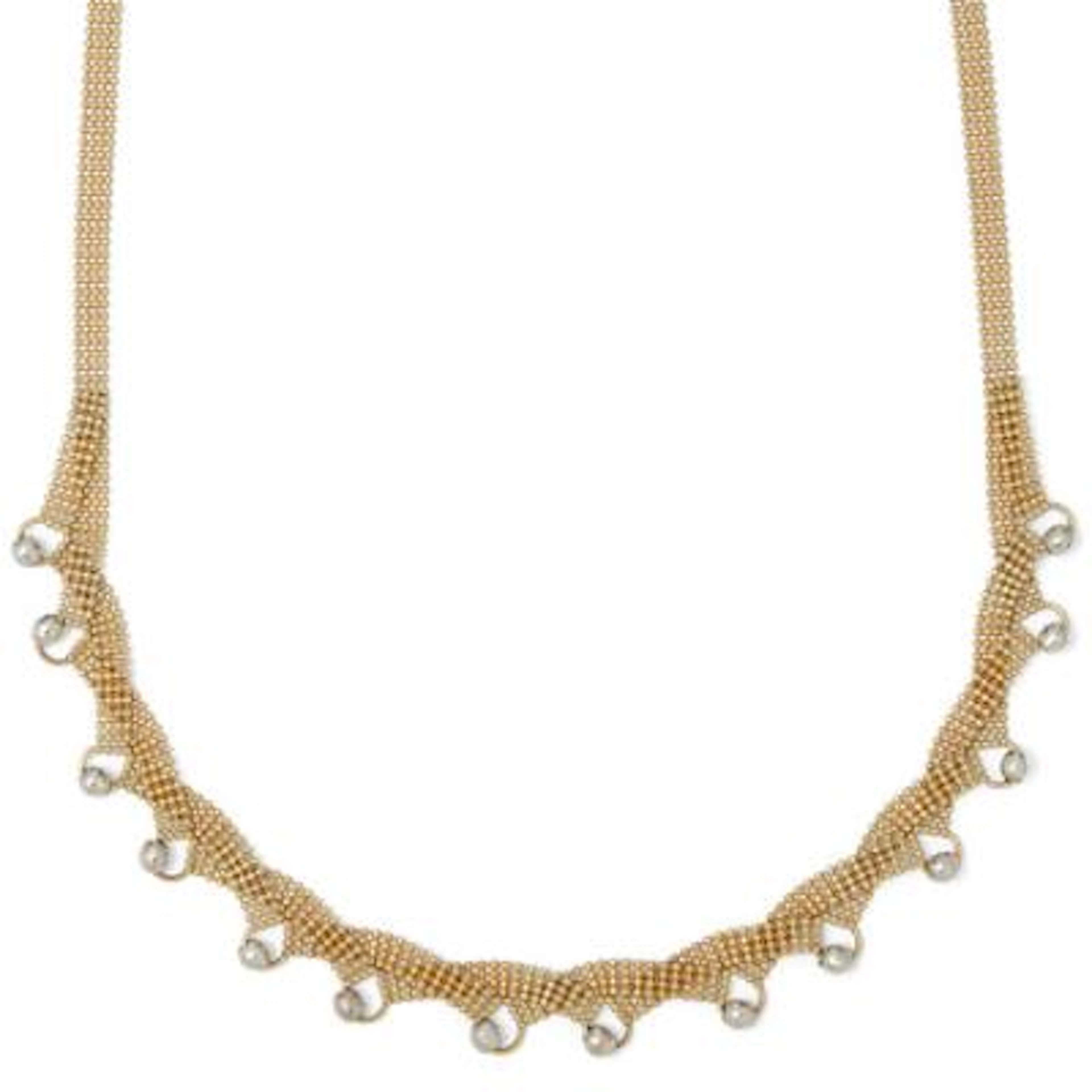 A necklace of 14k gold with beads of 14k white gold. Weight app. 11.5
