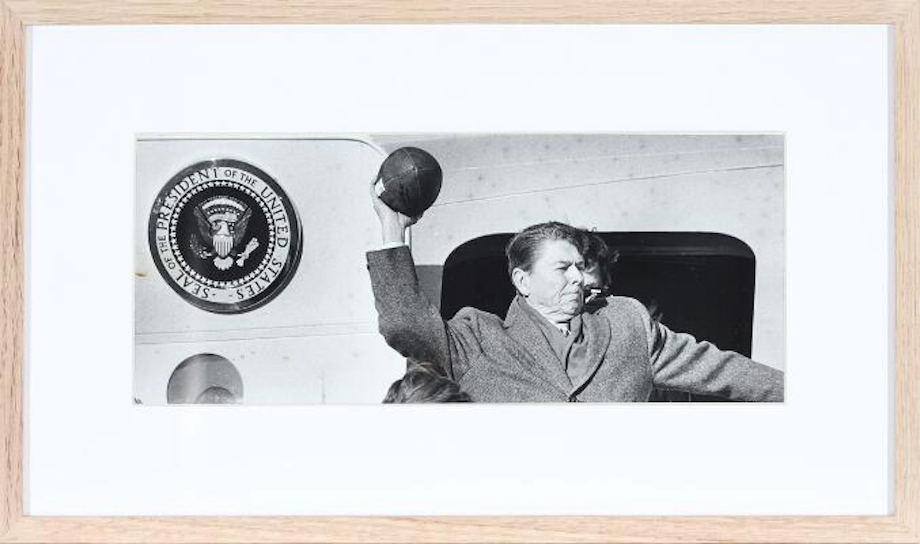 US President Ronald Reagan (1911–2004) throws a baseball during a