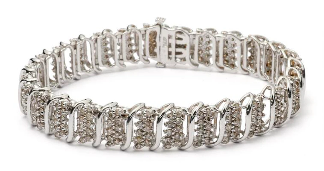 A diamond bracelet set with numerous diamonds mounted in 14k white