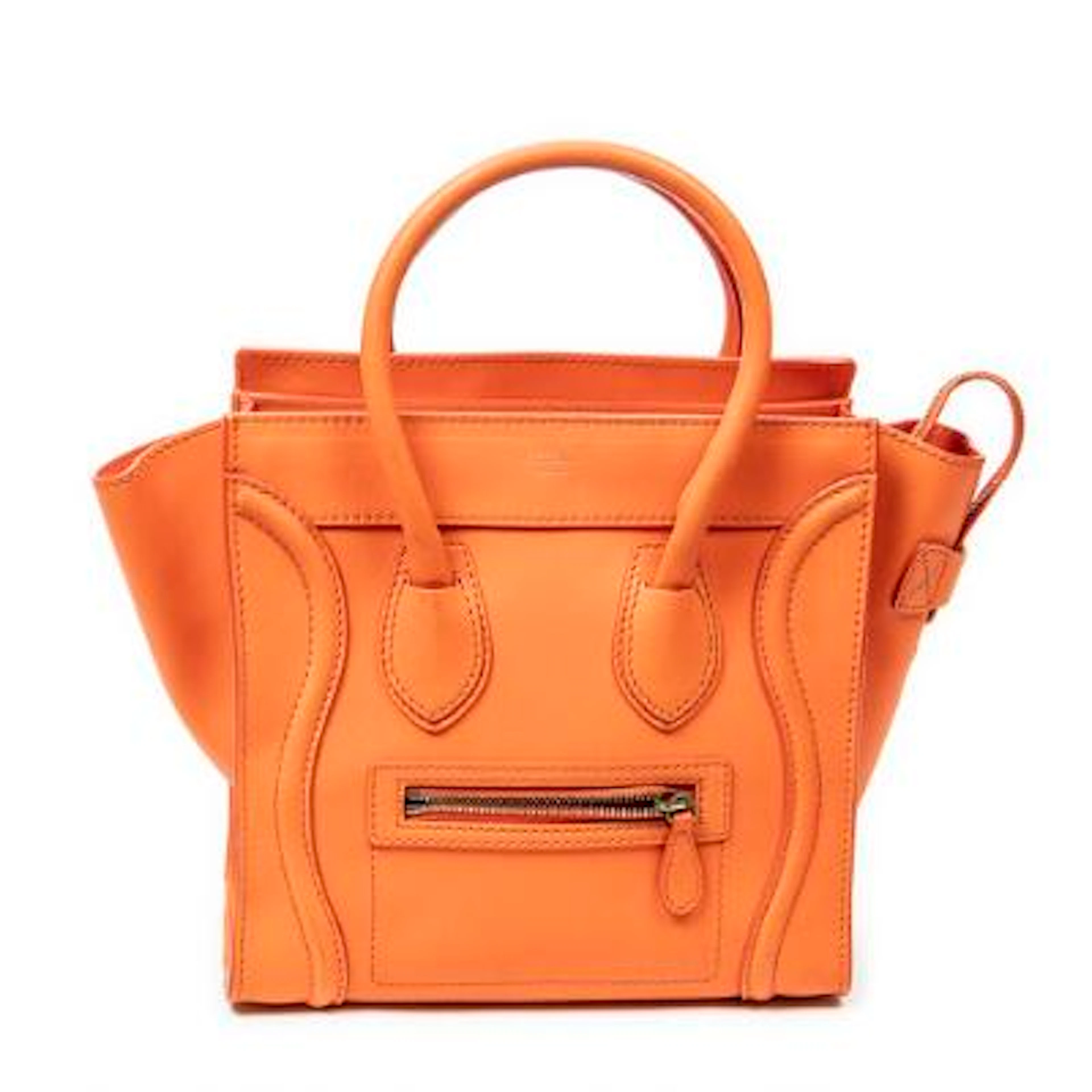 Celine: A "Micro Luggage" bag in orange leather with gold-tone hardware