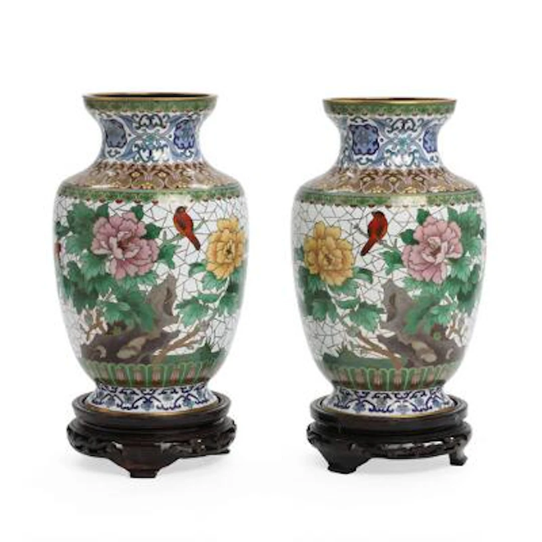 A pair of Chinese cloisonné vases, decorated with peonies and birds.
