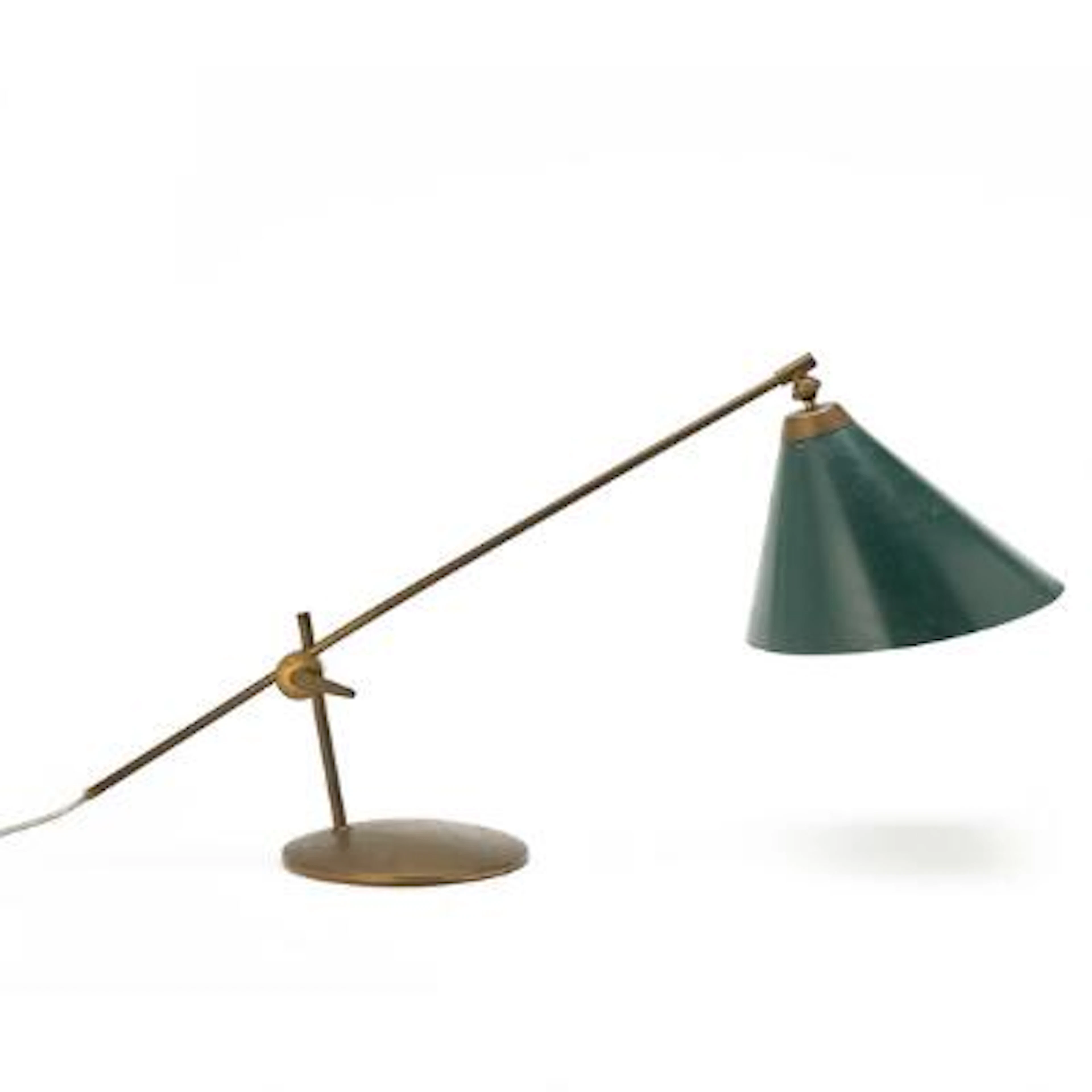Th. Valentiner: A brass table lamp with green lacquered metal shade.