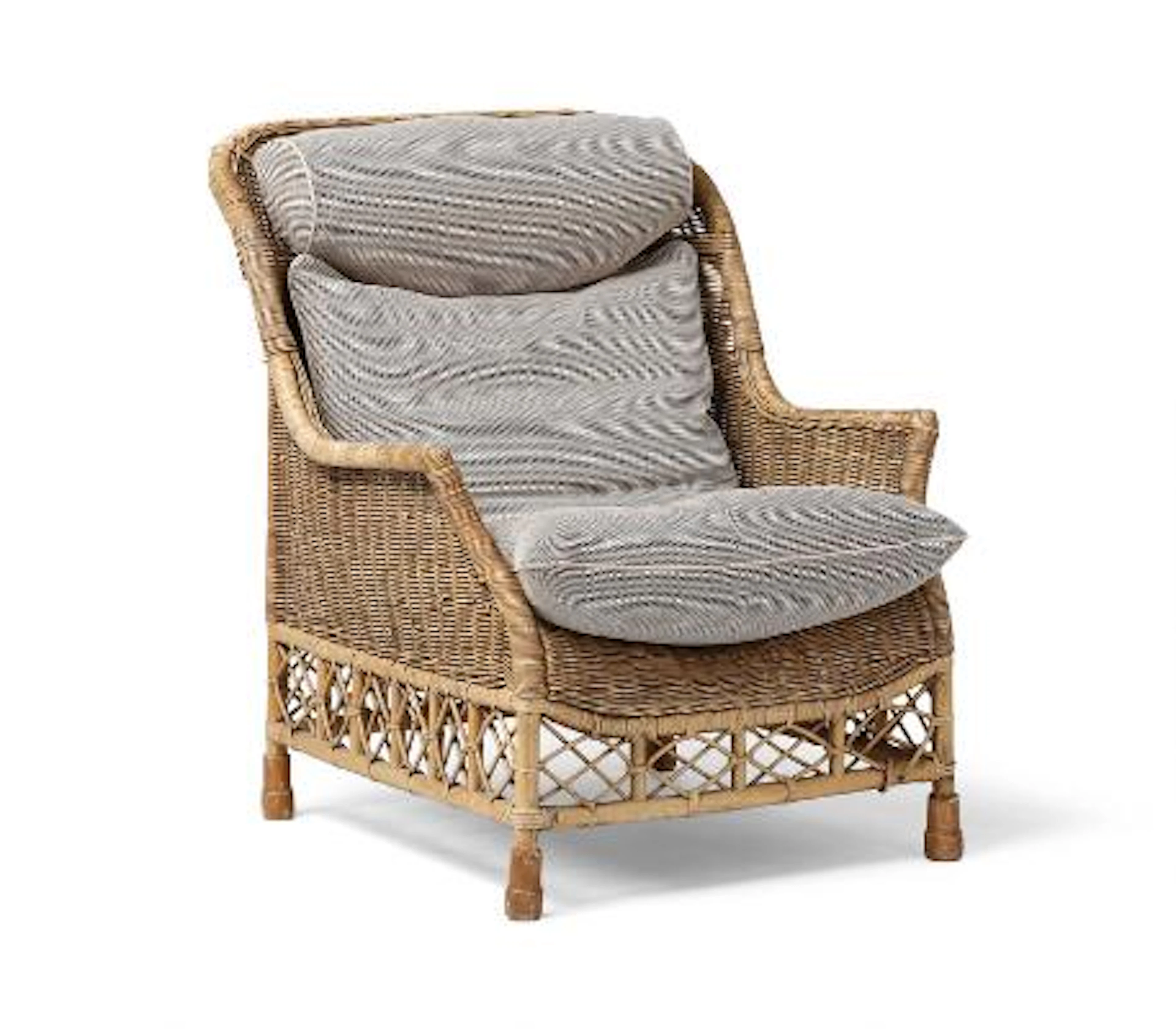 Søren Lund: “Karen Blixen”. A woven rattan lounge chair. Loose cushions