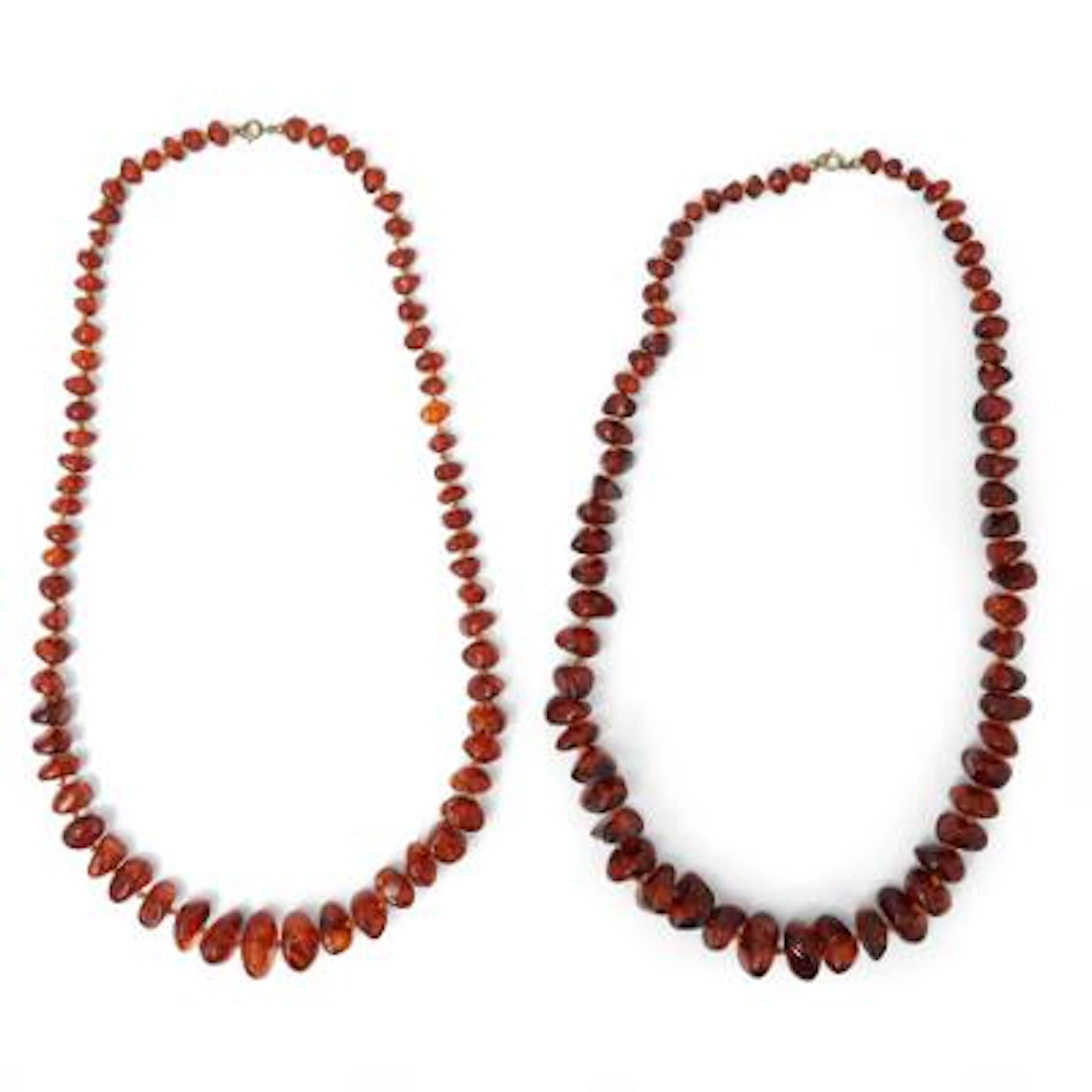 Two amber necklaces each set with numerous amber beads. Weight in