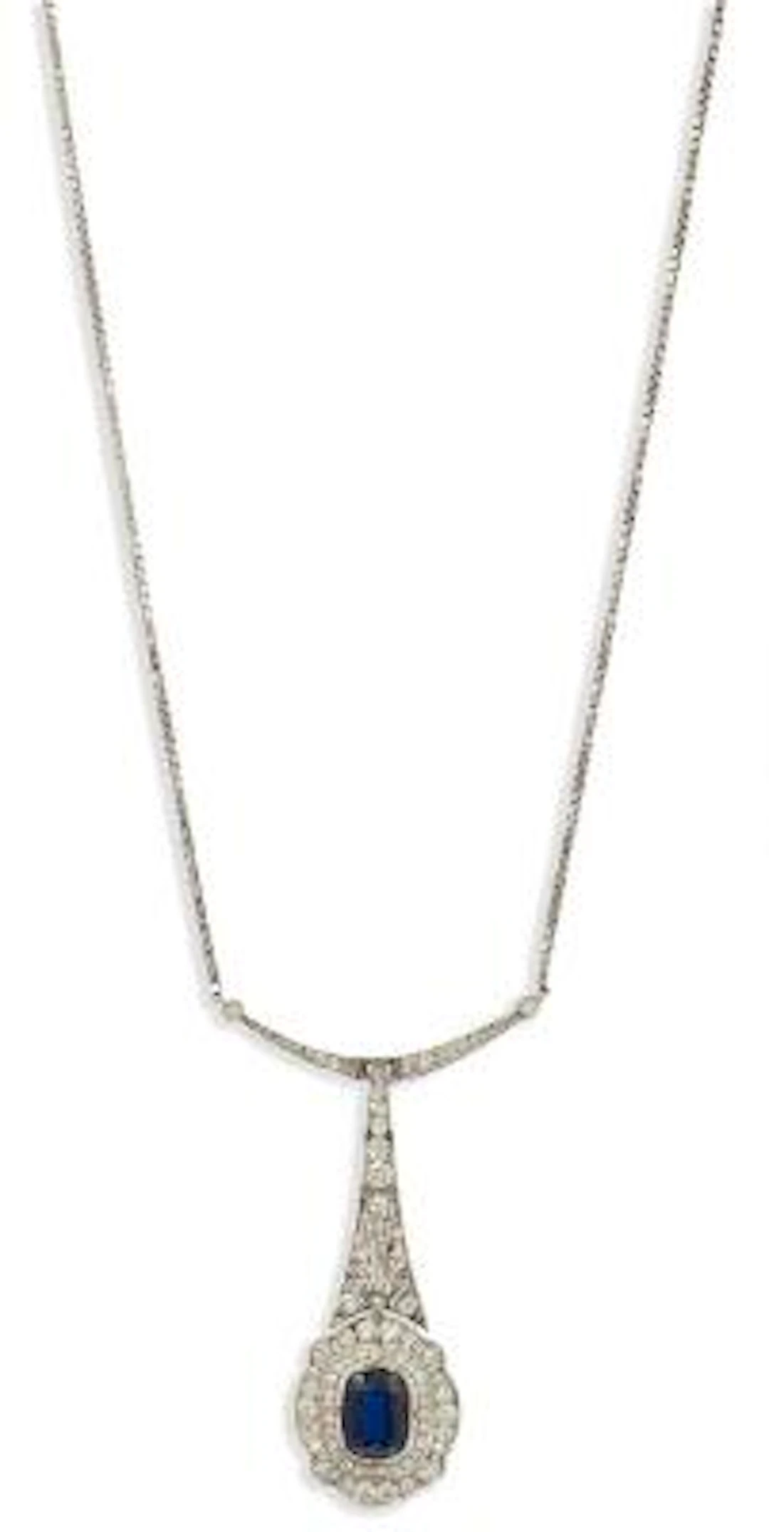 An Art Deco sapphire and diamond pendant of platinum and 14k gold