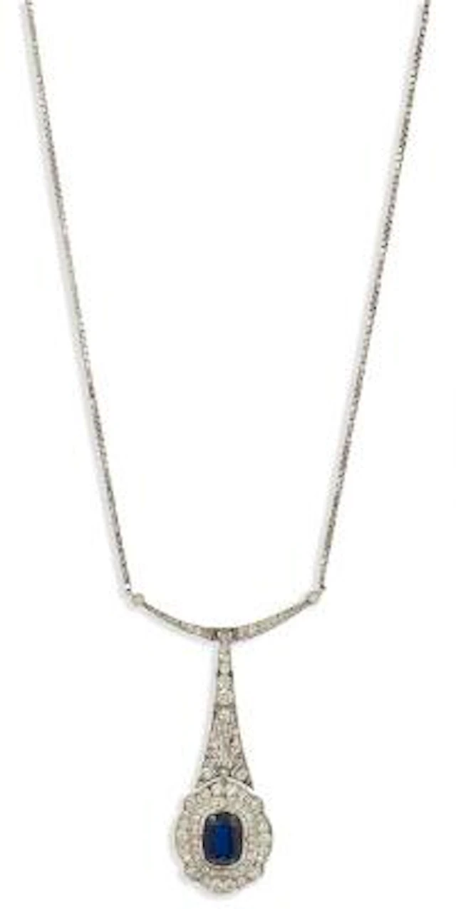 An Art Deco sapphire and diamond pendant of platinum and 14k gold