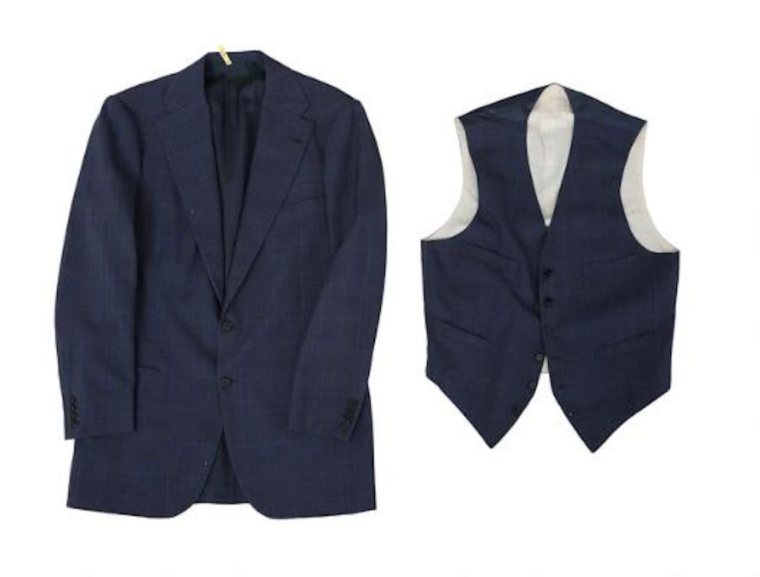 Alfred Alm: A navy Prince of Wales check jacket with matching waistcoat.