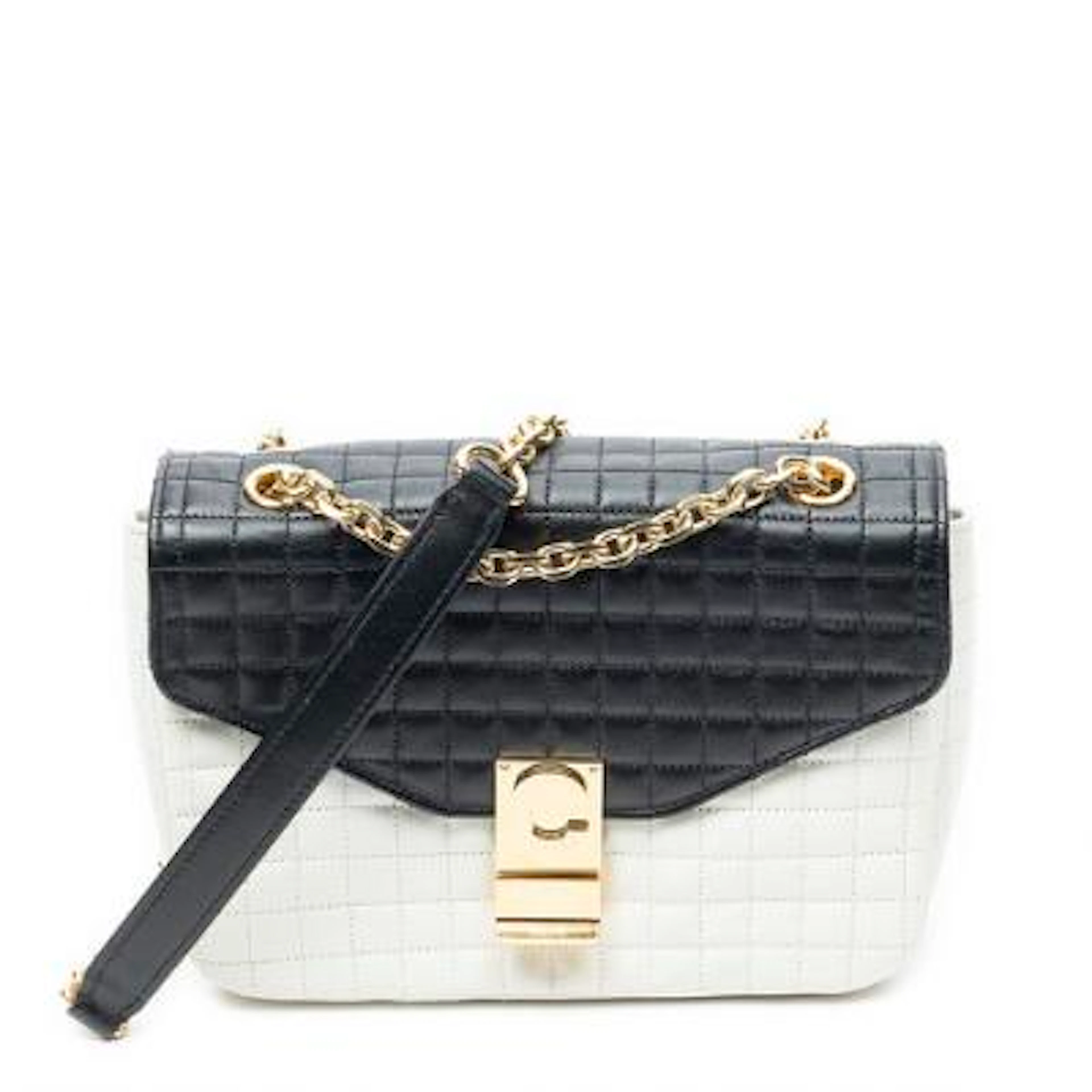 Céline: A bag of white and black quilted leather with gold-tone hardware.