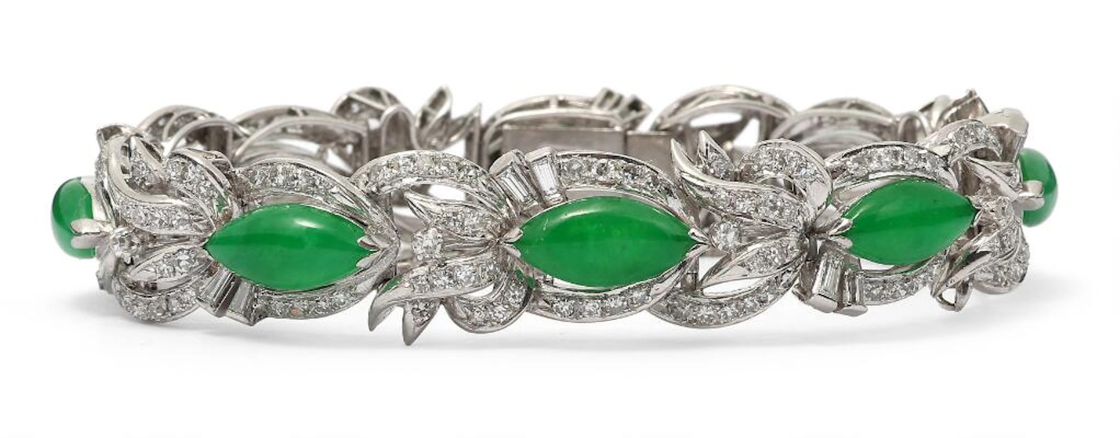 A jade and diamond bracelet set with jade and numerous diamonds, mounted