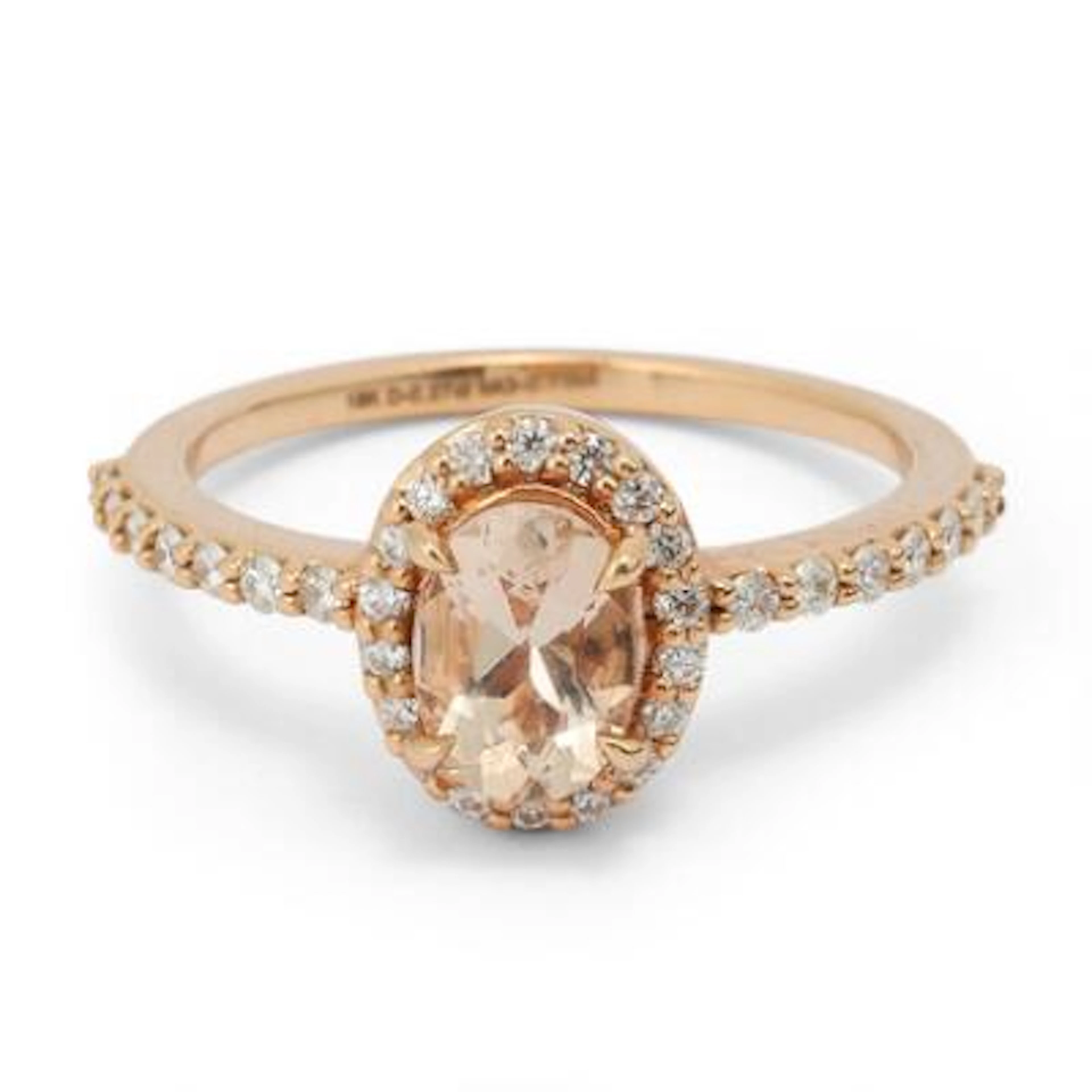 A morganite and diamond ring set with morganite and diamonds mounted