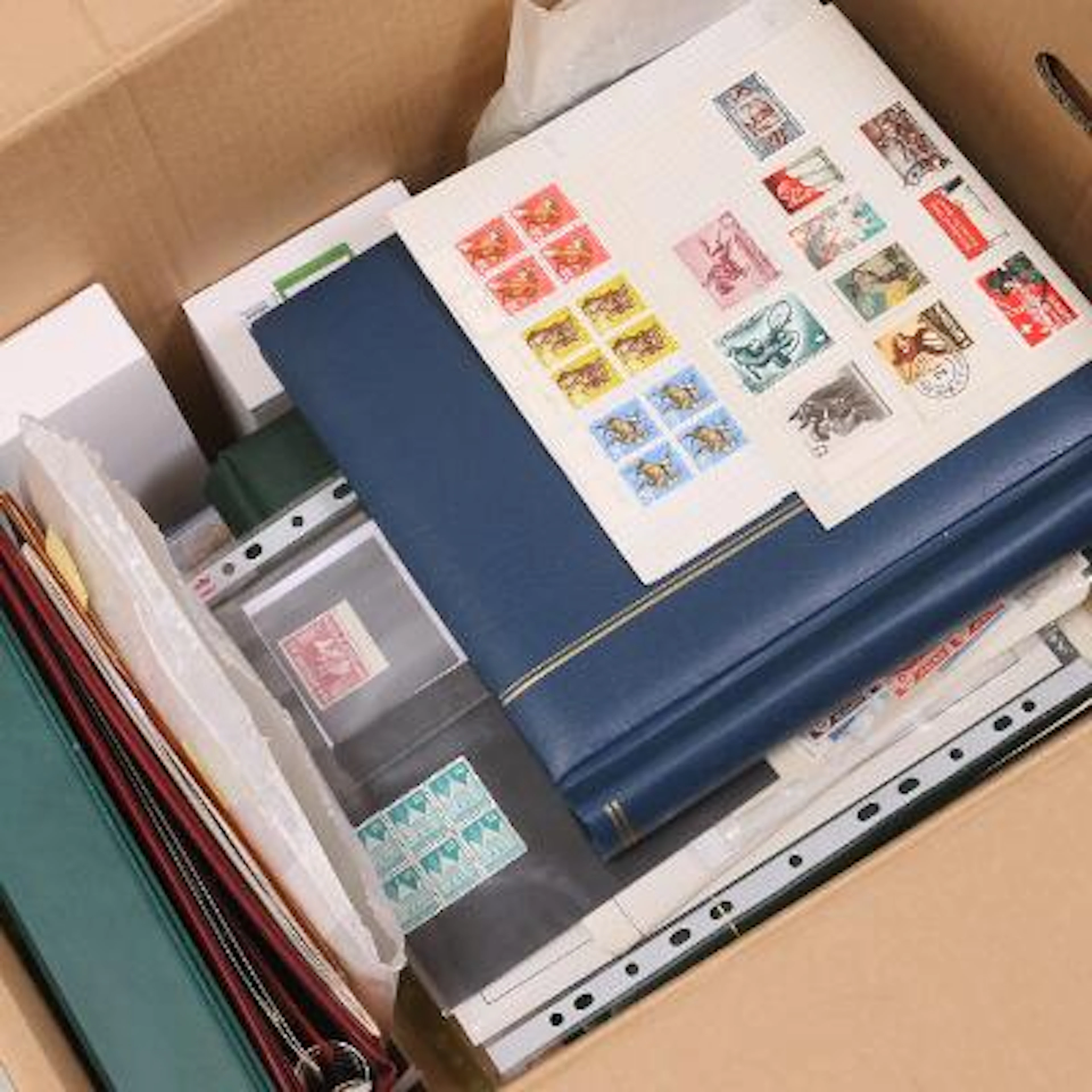 World. Large box with an older collection Iceland in an album, some