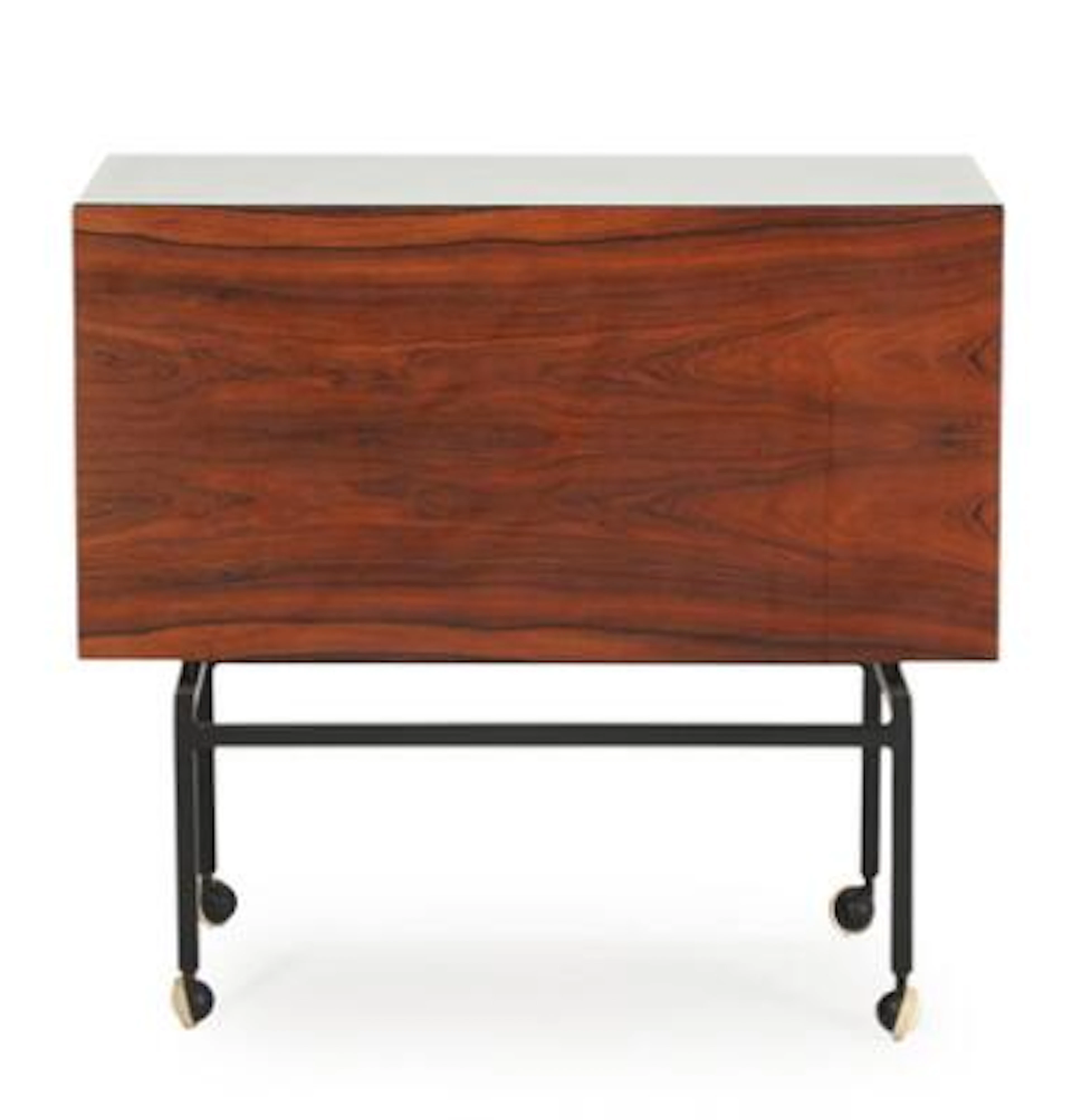 Poul Nørreklit: A rosewood bar cart, sliding top with white formica.