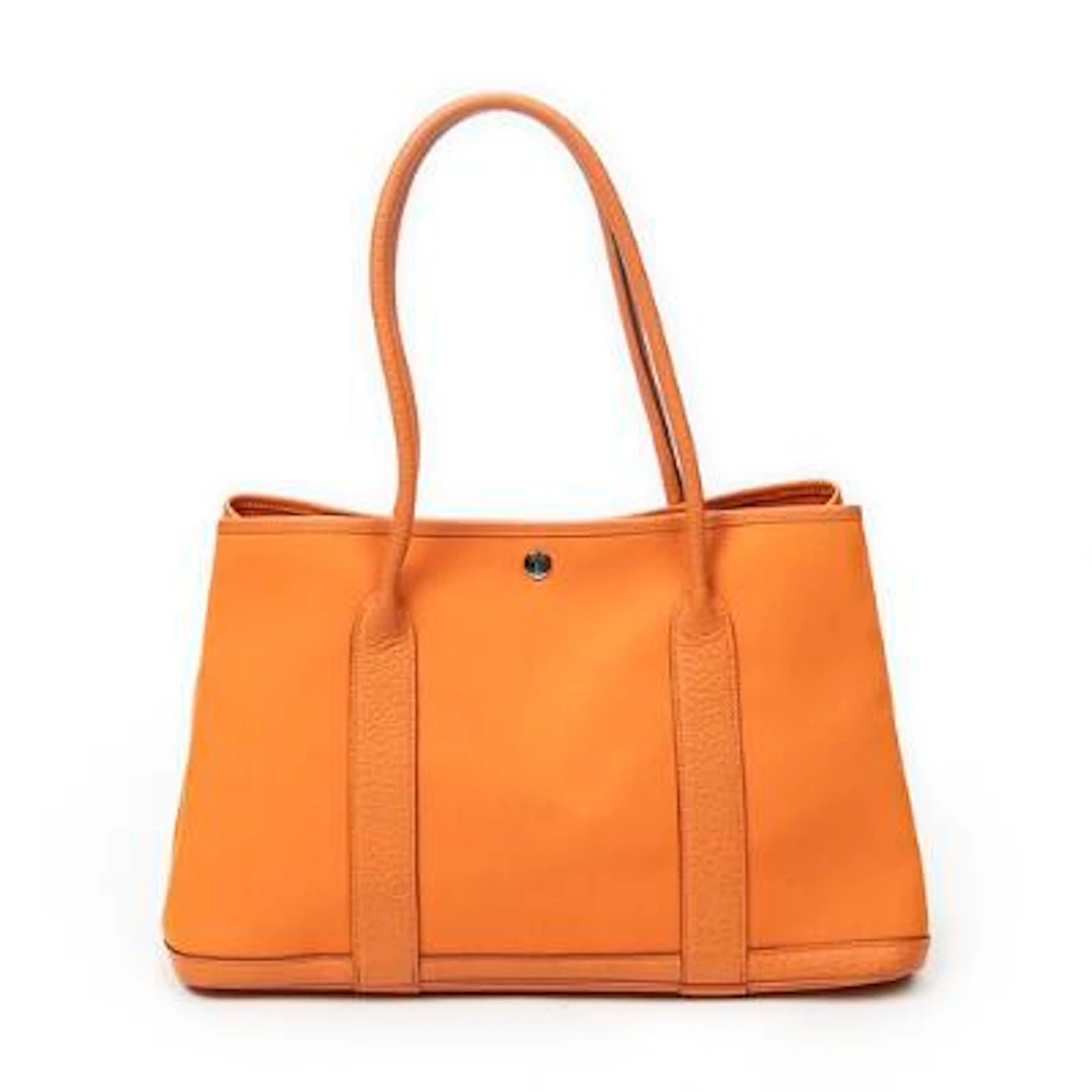Hermès: A "Garden Party Shoulder 39" bag in orange Toile Officier-canvas