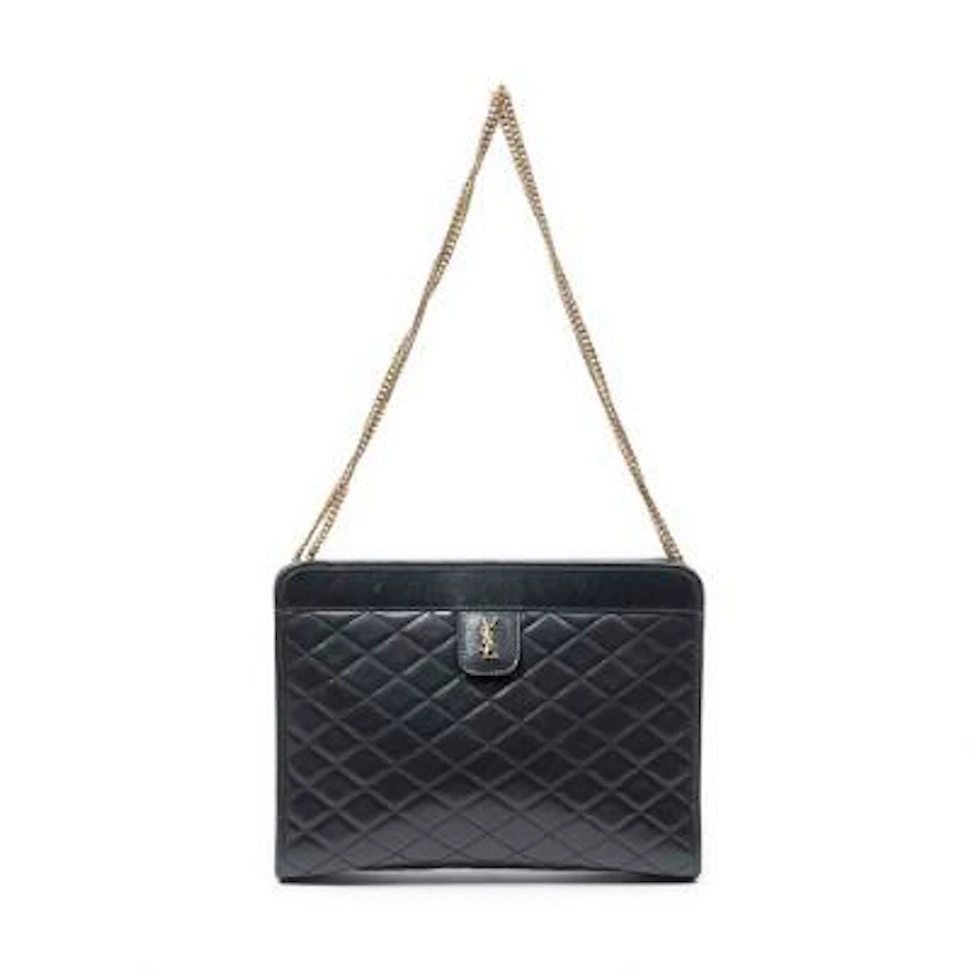 Yves Saint Laurent: A "Victoire Chain Clutch" in black quilted leather
