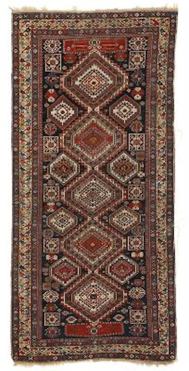 An antique Shirvan galleri rug, Caucasus. Design of linked step medallion