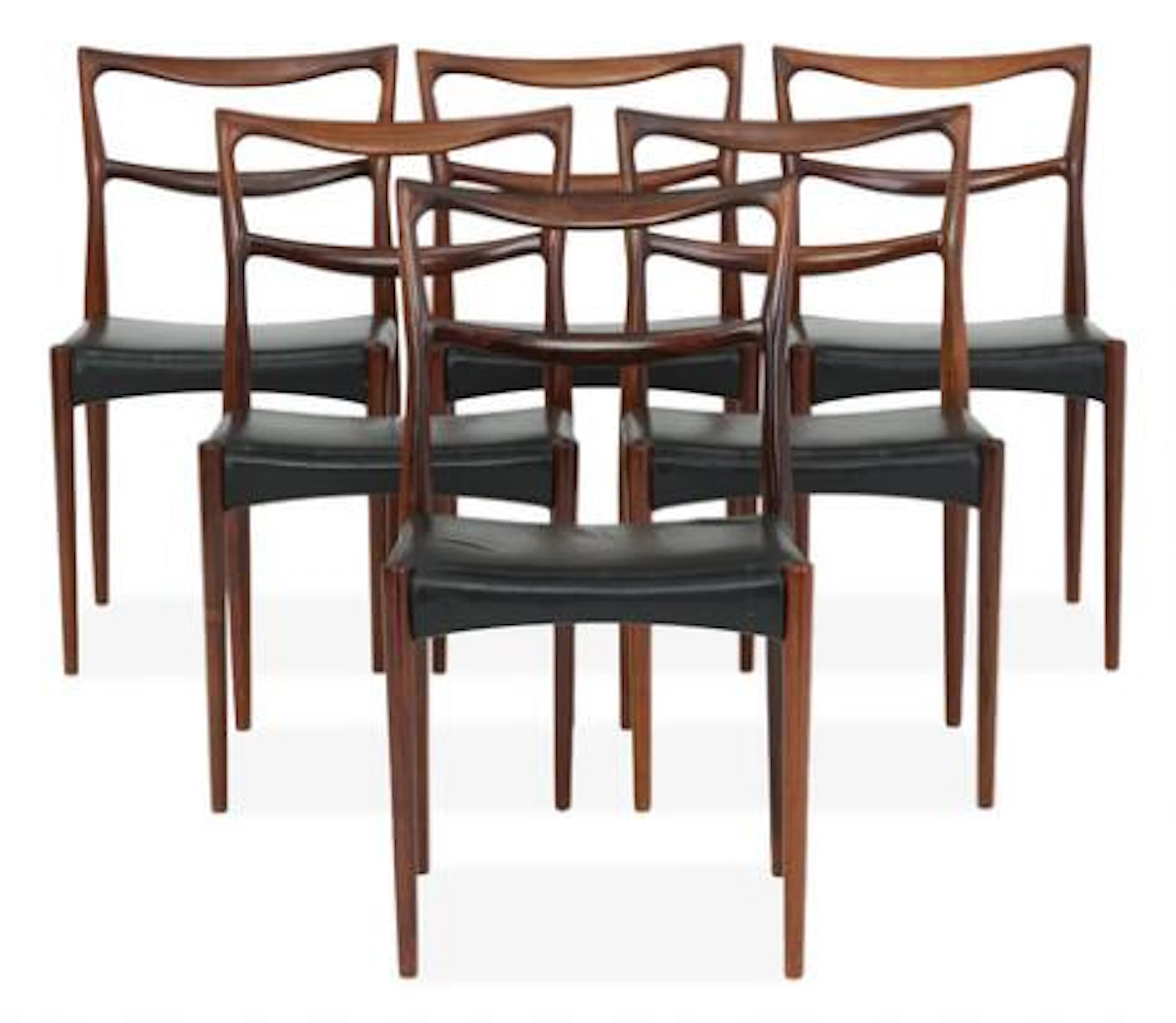 Johannes Andersen: A set of six rosewood dining chairs. Seats upholstered