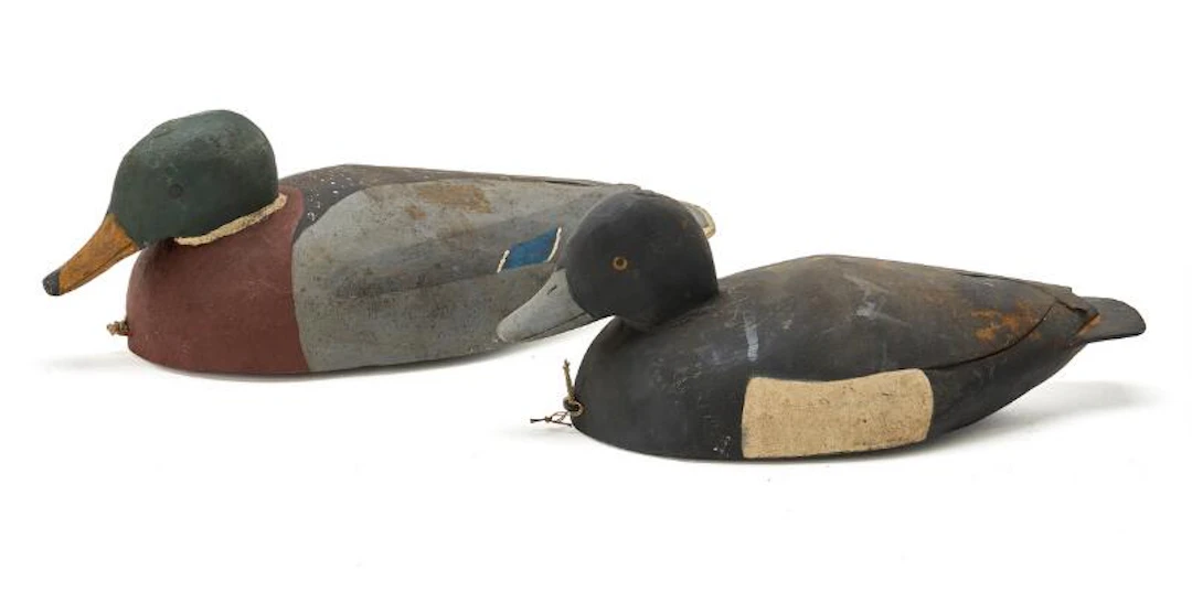By an unknown artist: Two decoy ducks of carved and painted wood.
