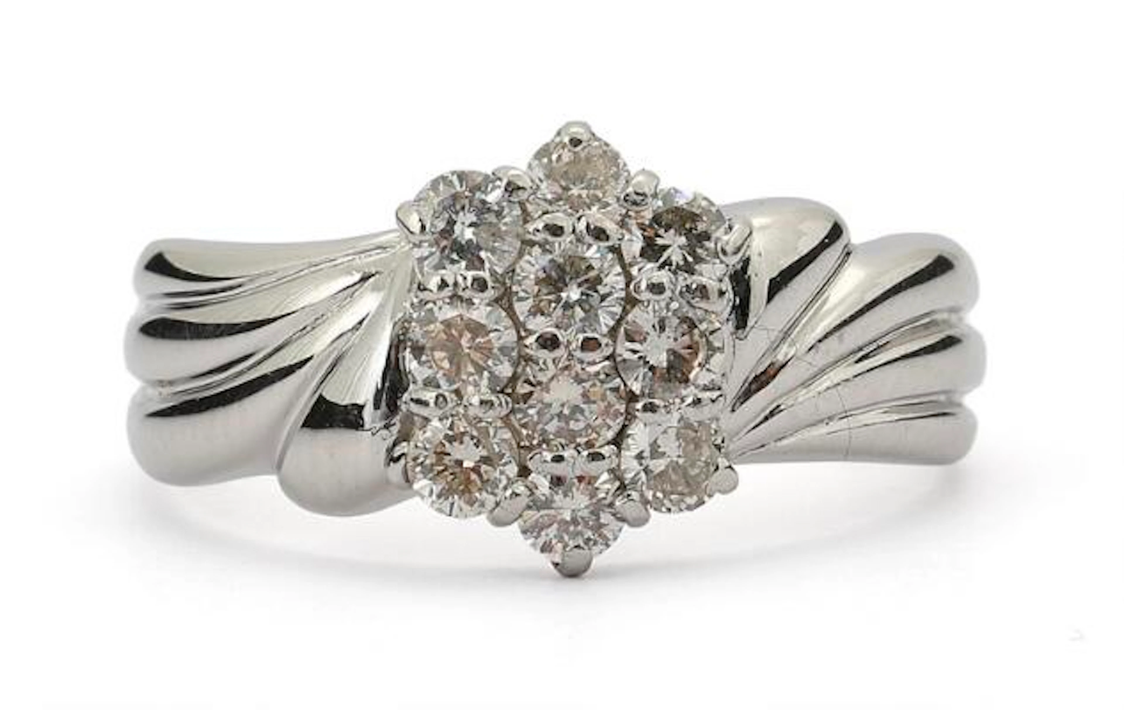 A diamond ring set with numerous brilliant-cut diamonds, mounted in