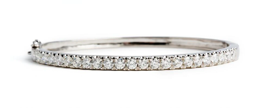 A diamond bangle set with numerous diamonds weighing a total of app.