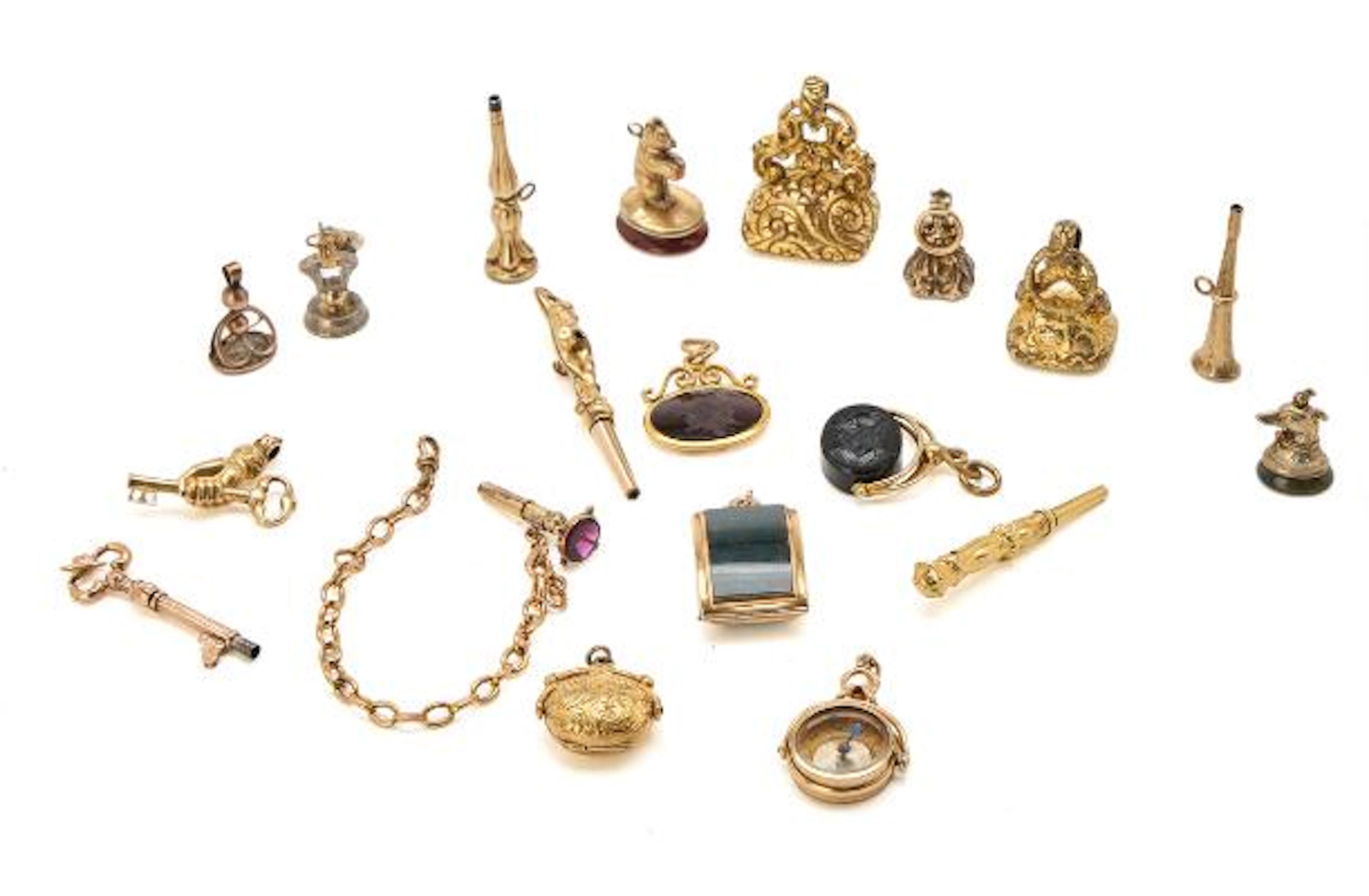 A collection of medallions, seals and keys together with a compass