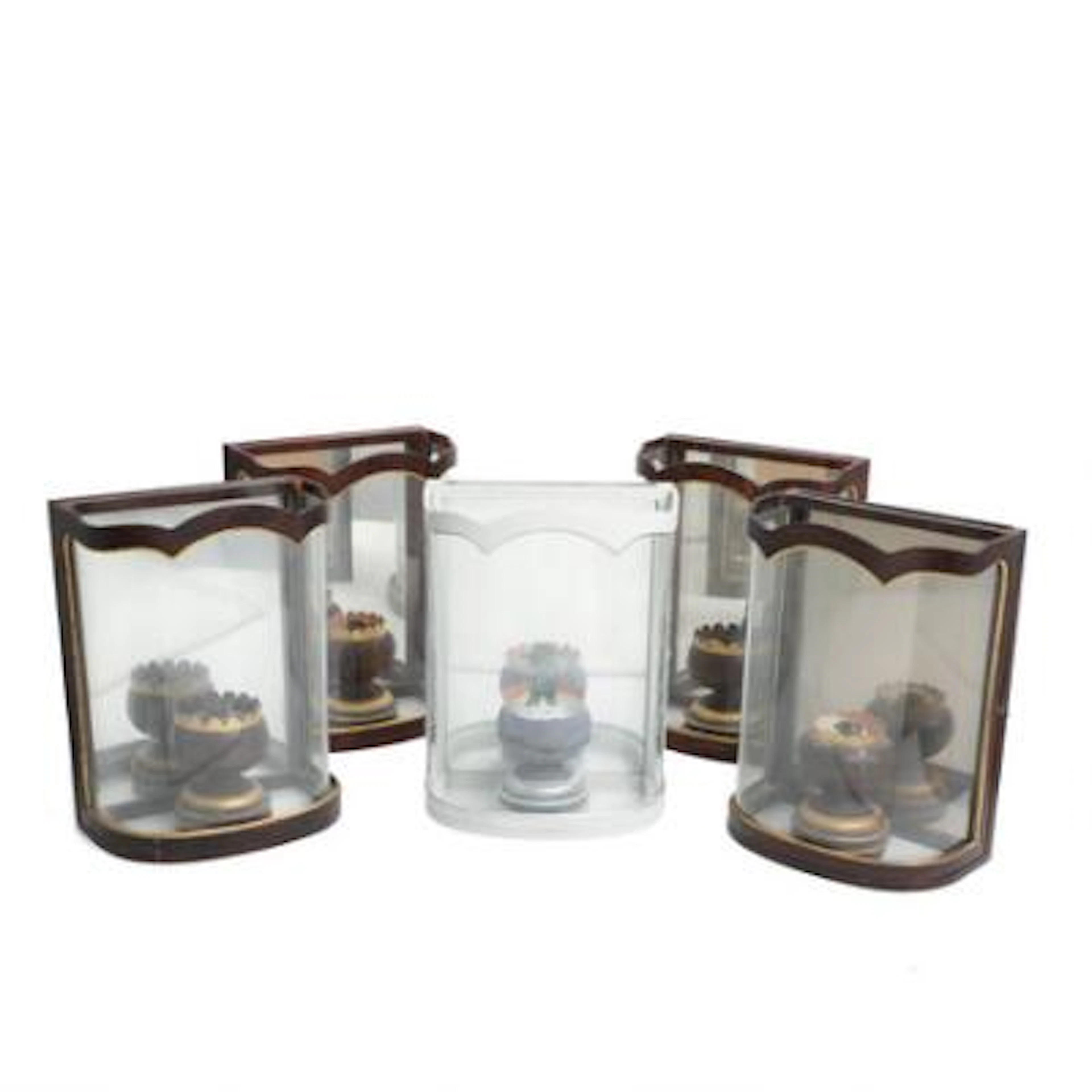 Five wall-mounted lanterns in painted wood. Colefax and Fowler style.