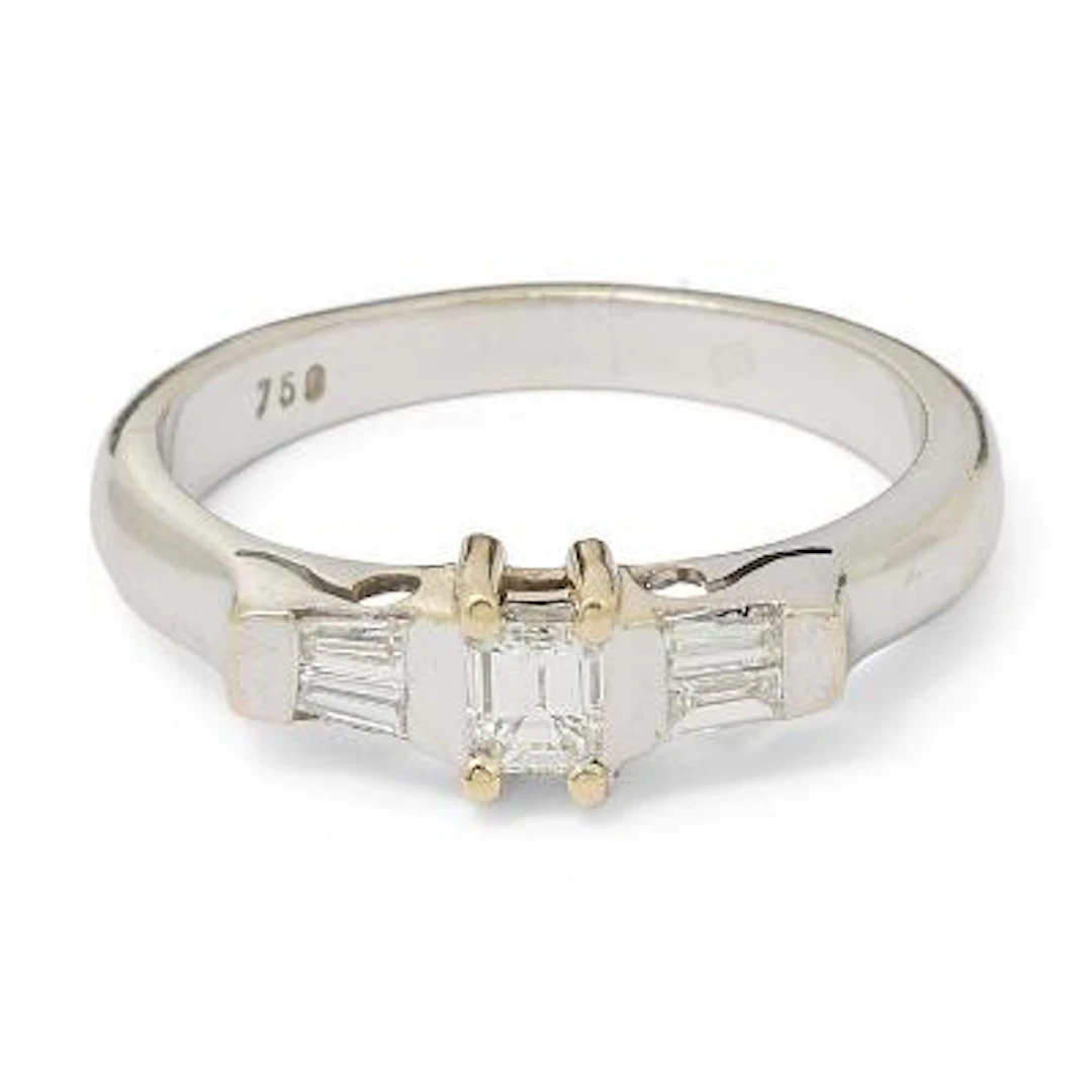 A diamond ring set with diamonds mounted in 18k gold and white gold.