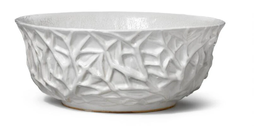 Axel Salto: A circular stoneware bowl, the outside modelled with relief