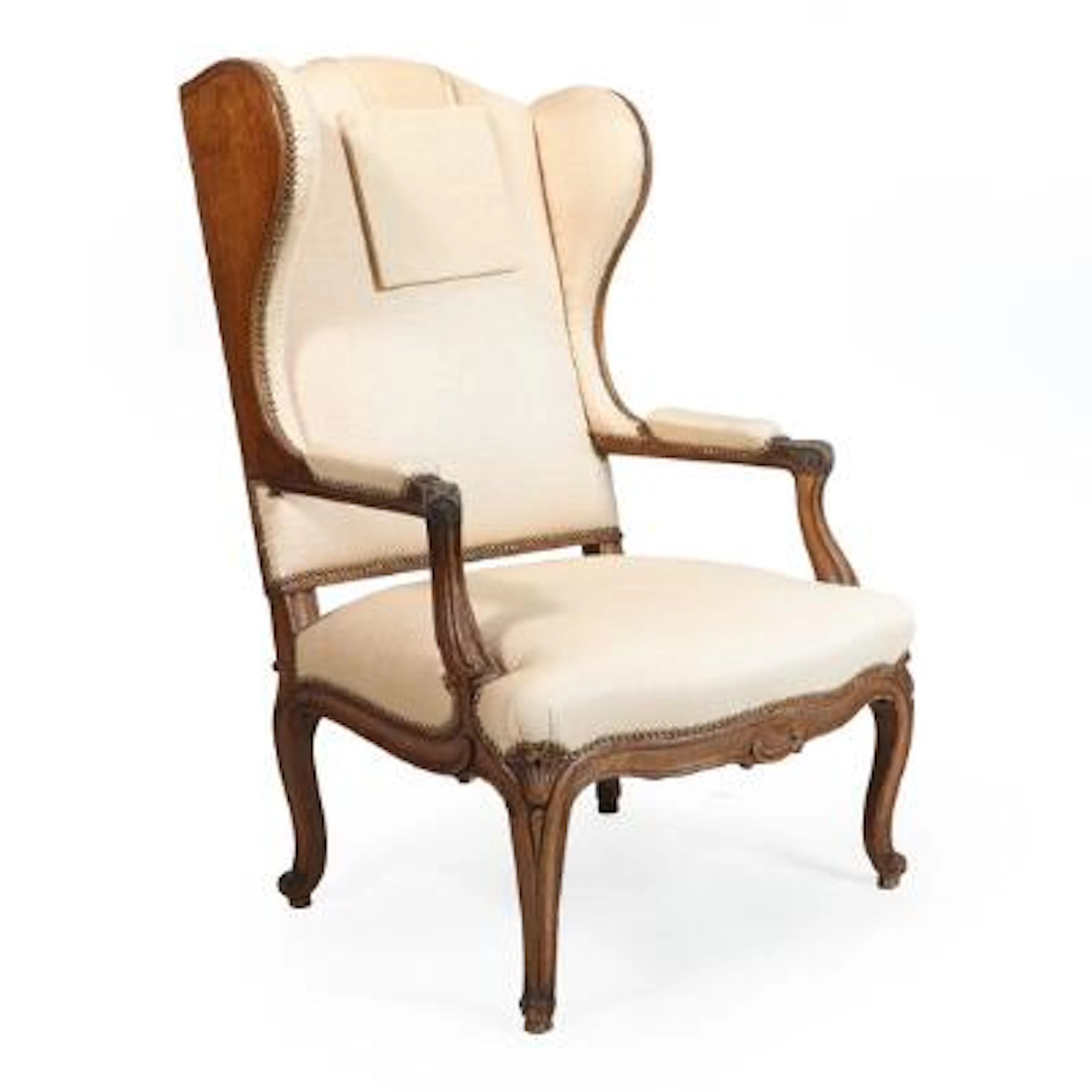 Wingback chair in oak, seat, back and armrests upholstered in light